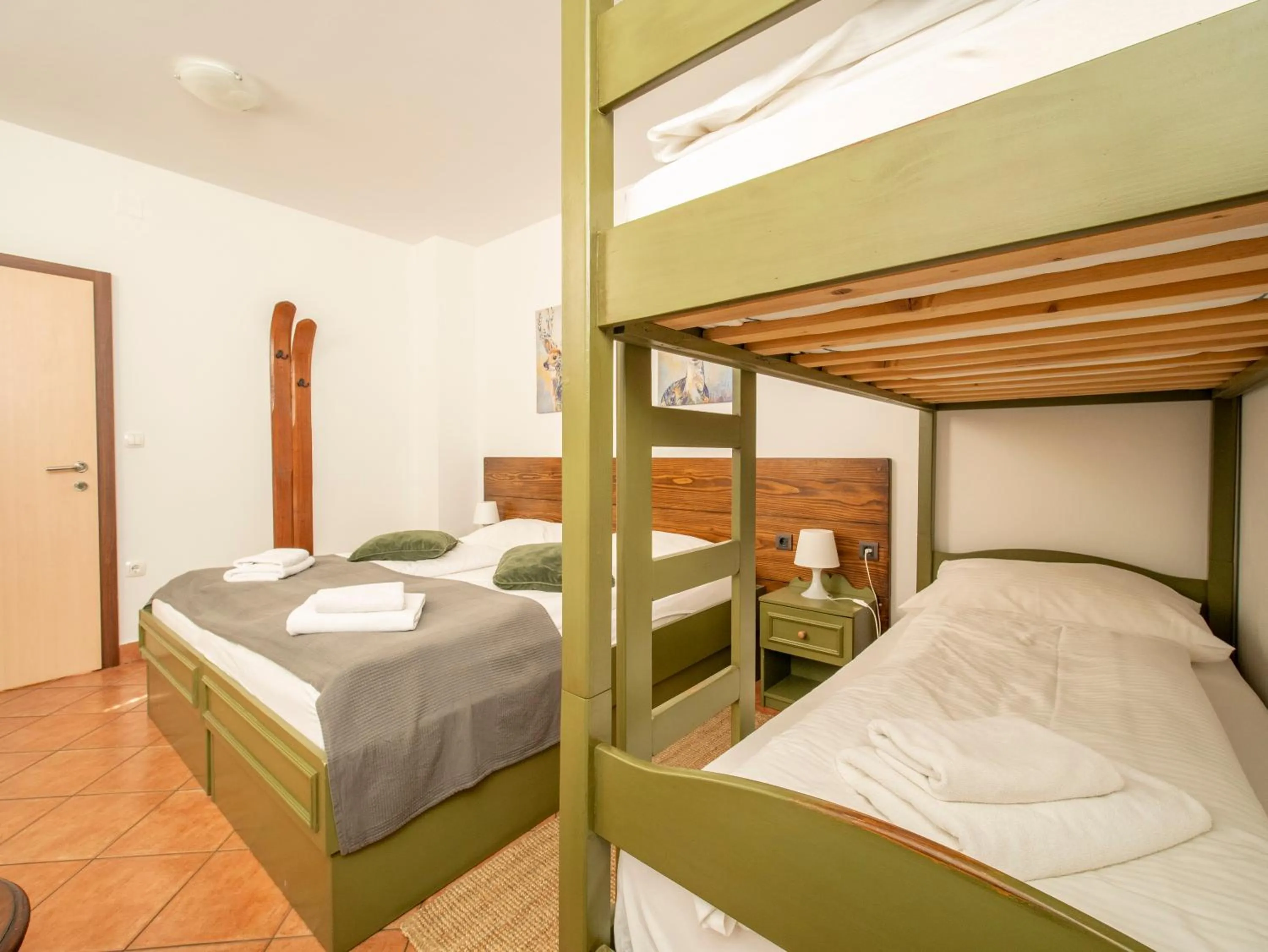 Bed in Berghi Hotel and Apartments