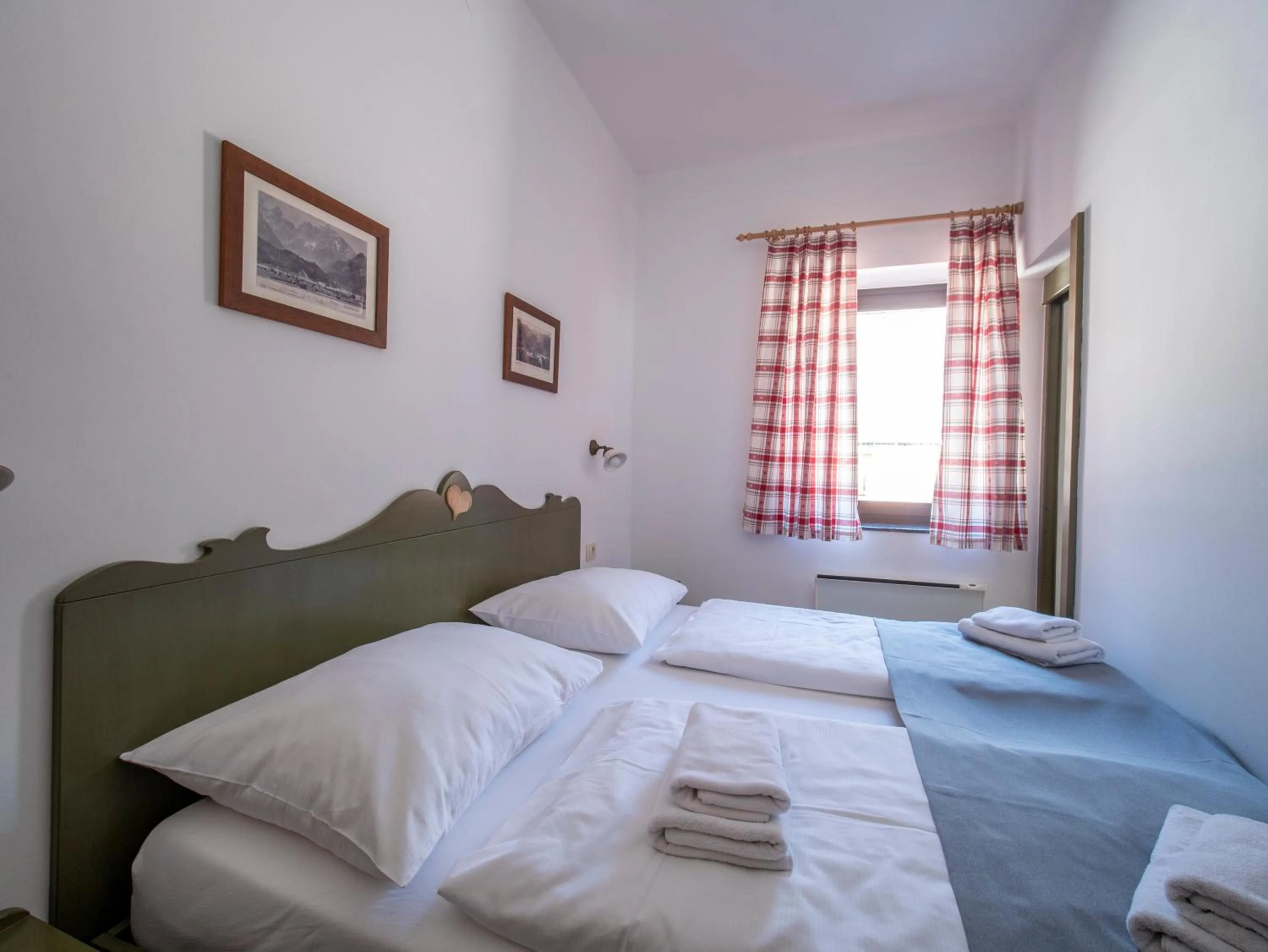 Bed in Berghi Hotel and Apartments