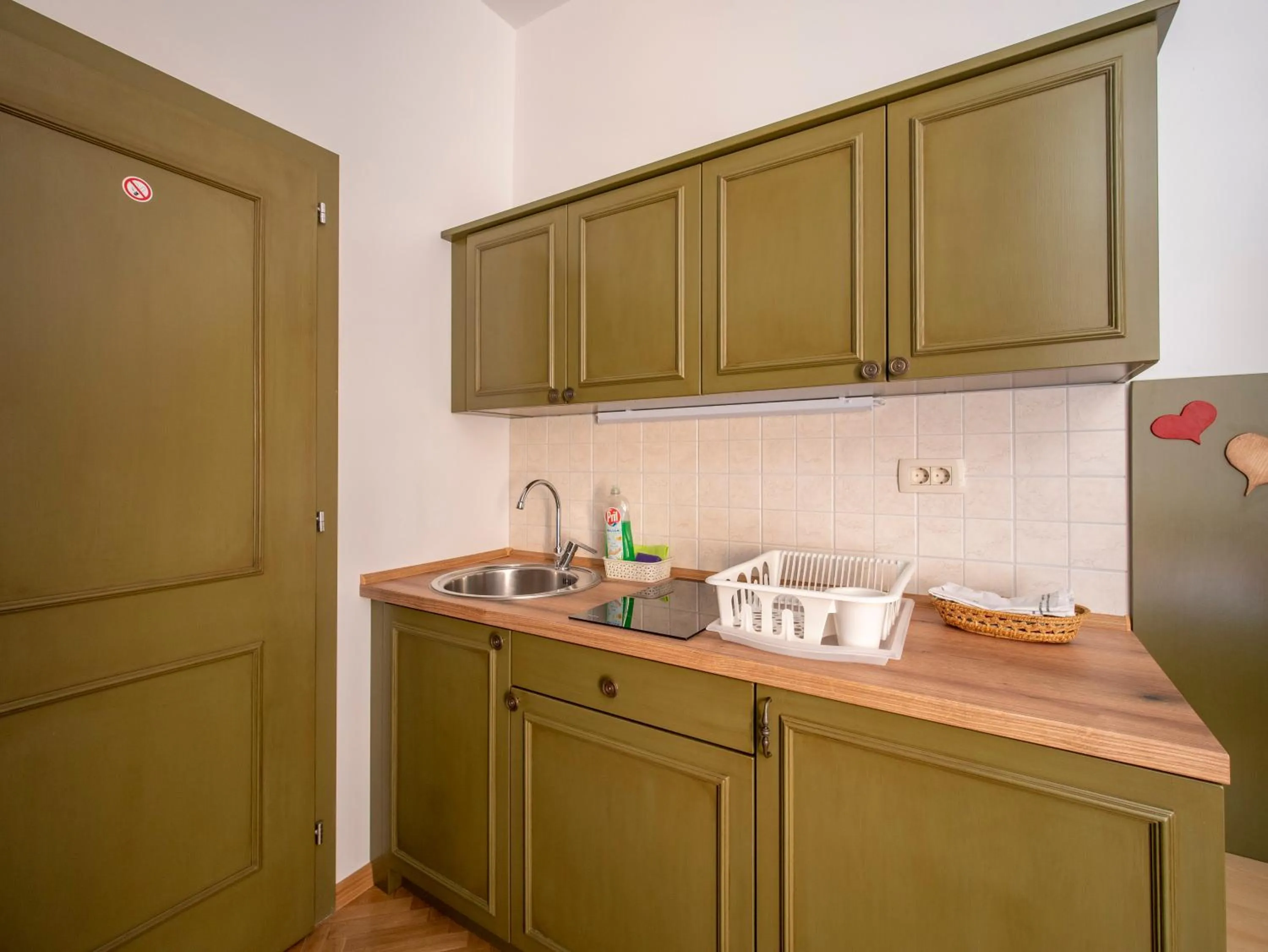 Kitchen or kitchenette in Berghi Hotel and Apartments