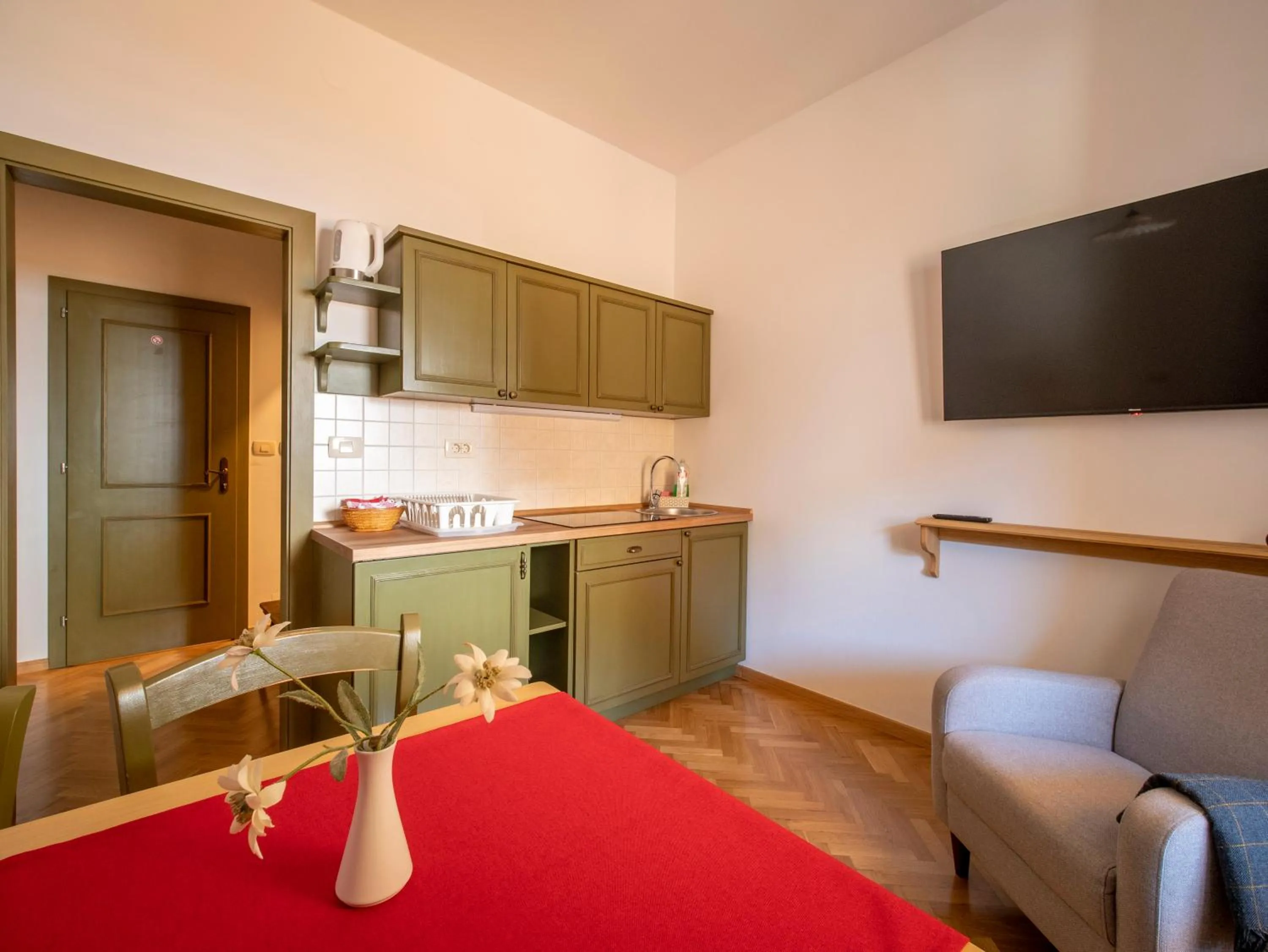Kitchen or kitchenette in Berghi Hotel and Apartments