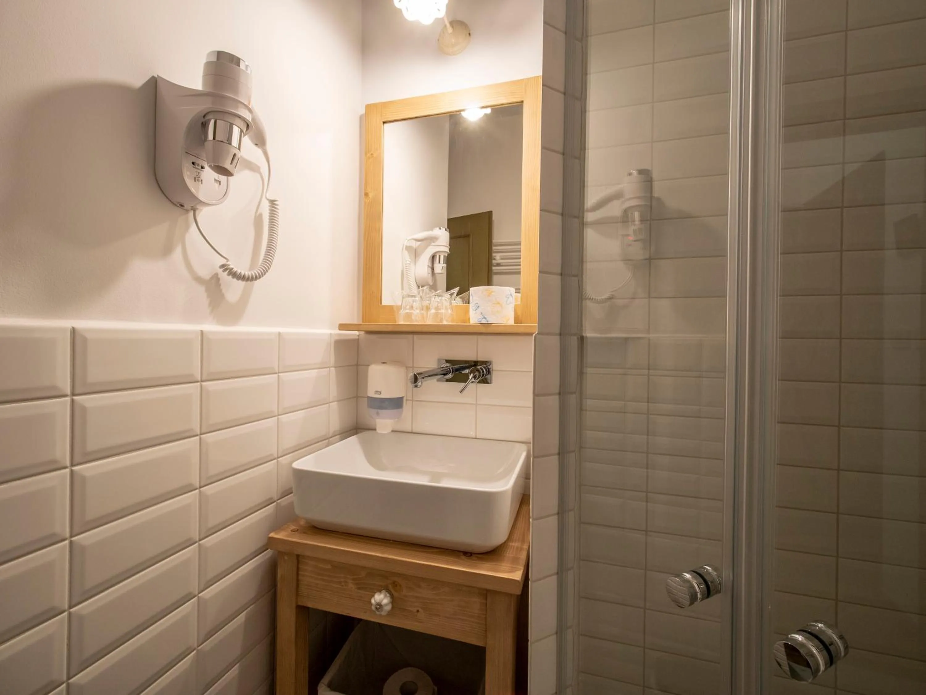 Bathroom in Berghi Hotel and Apartments