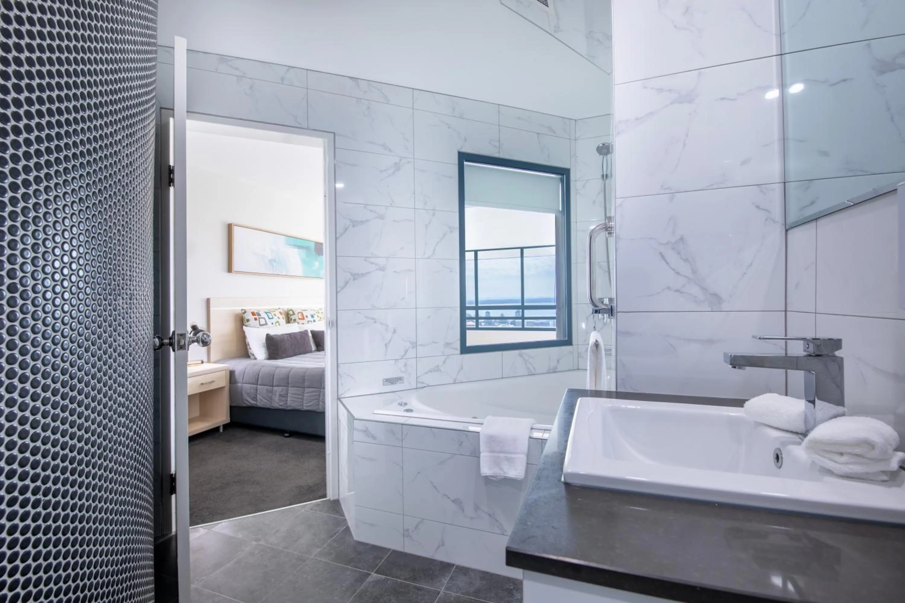 Bathroom, Bed in Landmark Resort