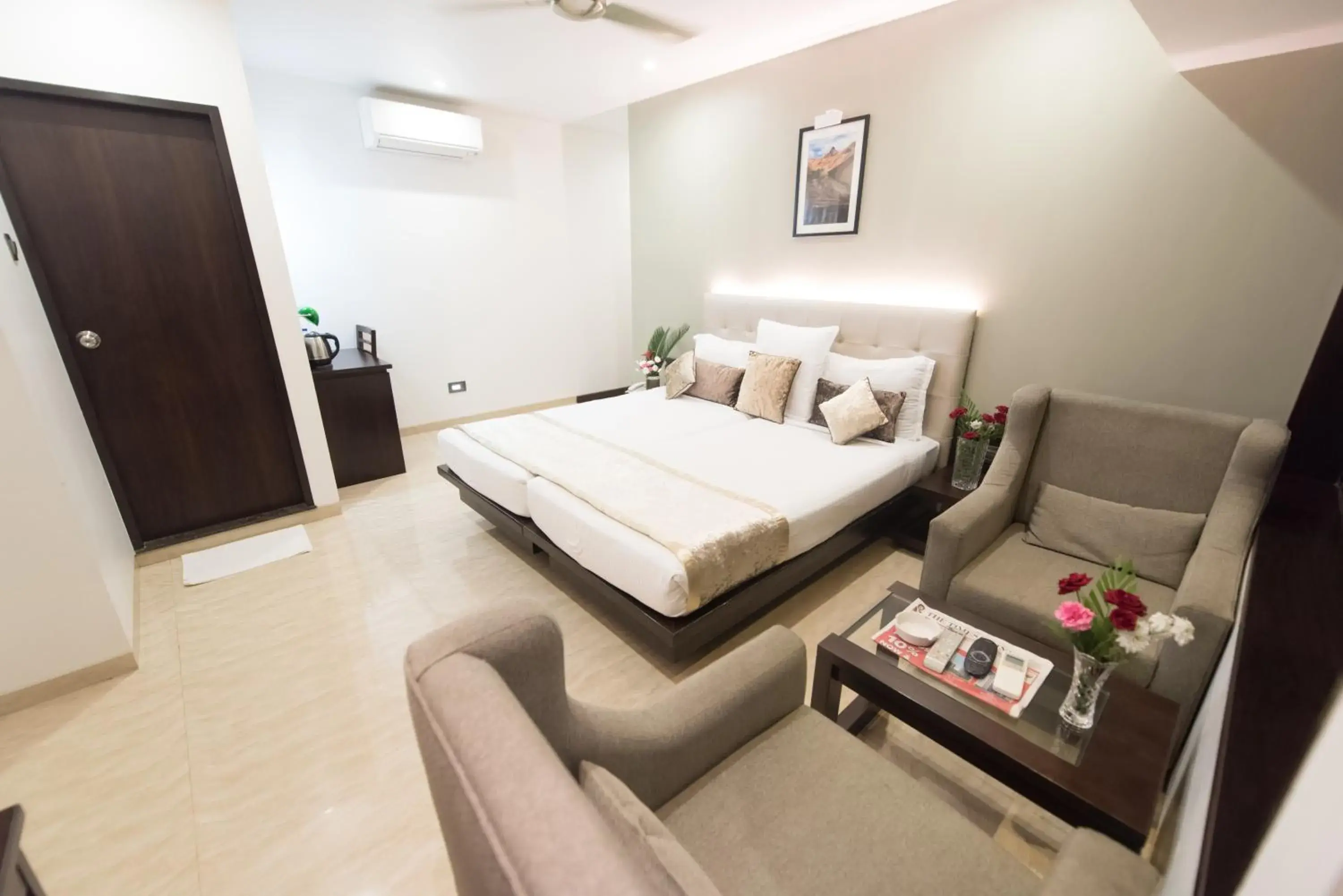 Seating area, Bed in Hotel Le Grande - Mumbai International Airport Seating area, Bed in Hotel Le Grande - Mumbai International Airport