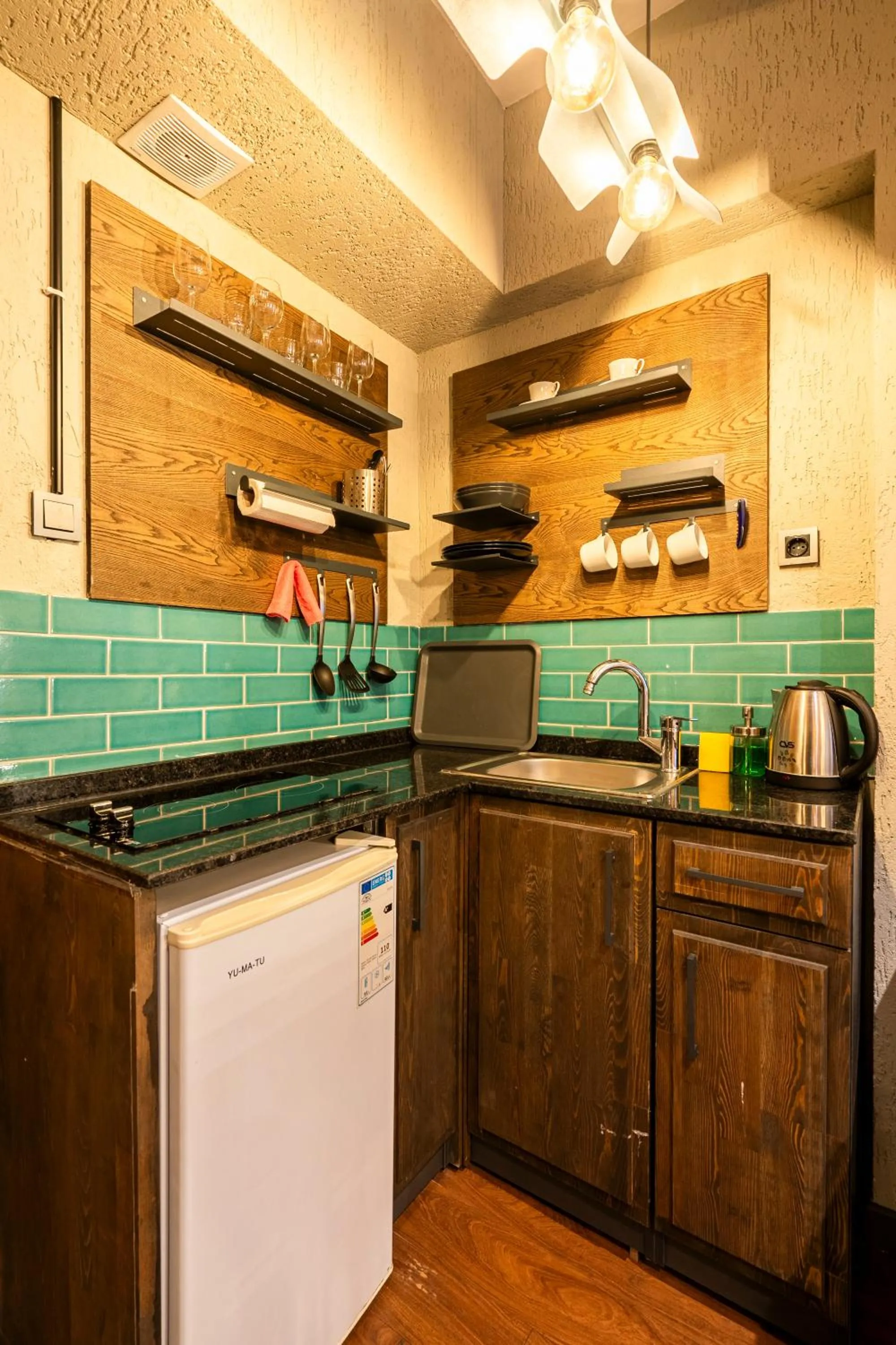 Kitchen or kitchenette in Cube Suites