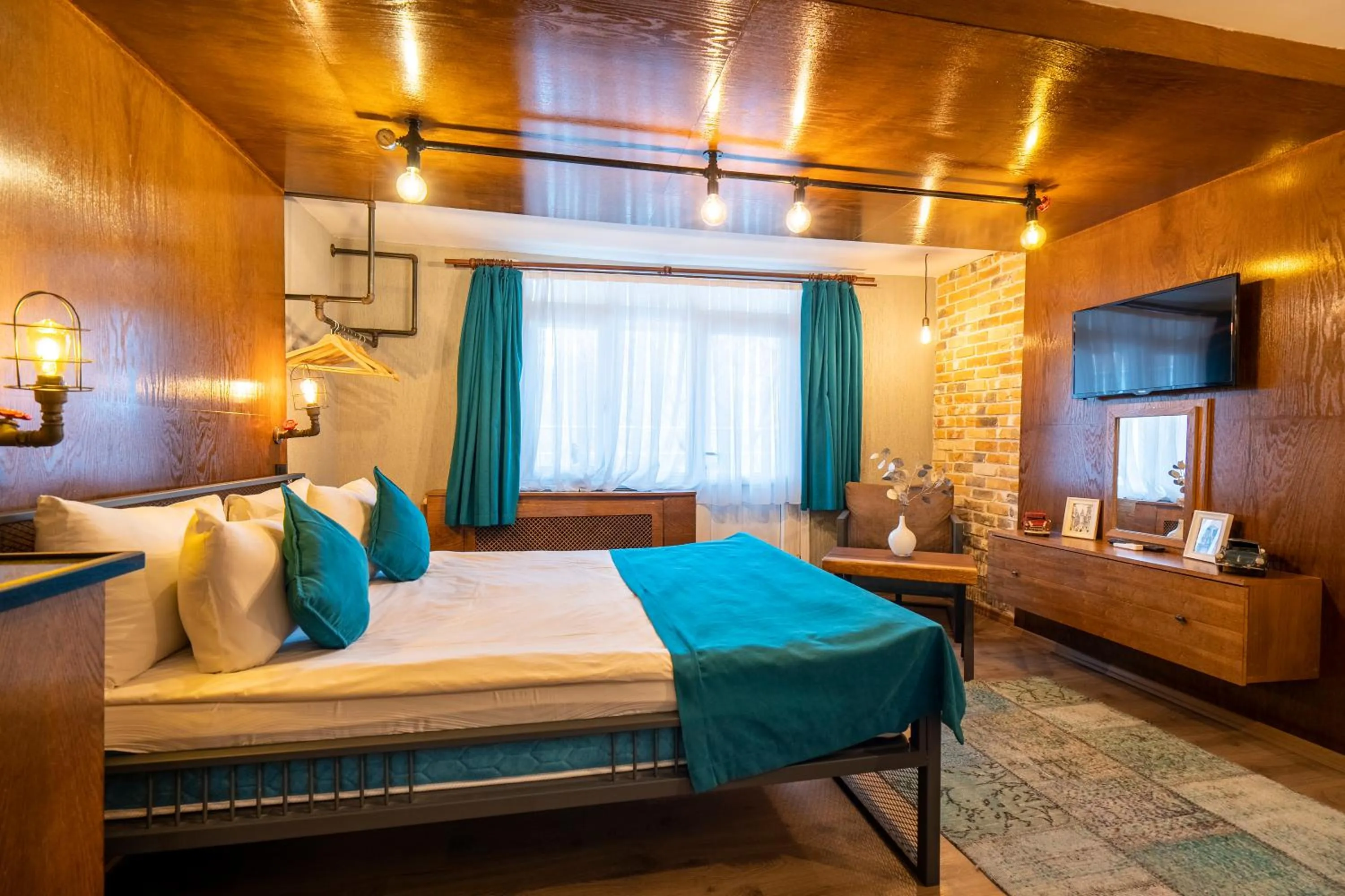 Photo of the whole room, Bed in Cube Suites