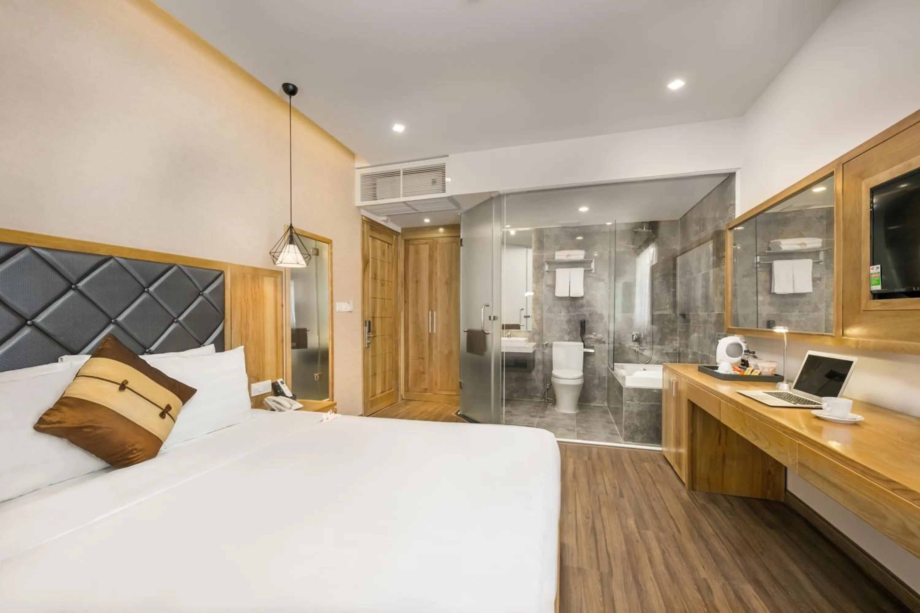 Bed in Grand Sunrise Boutique Hotel