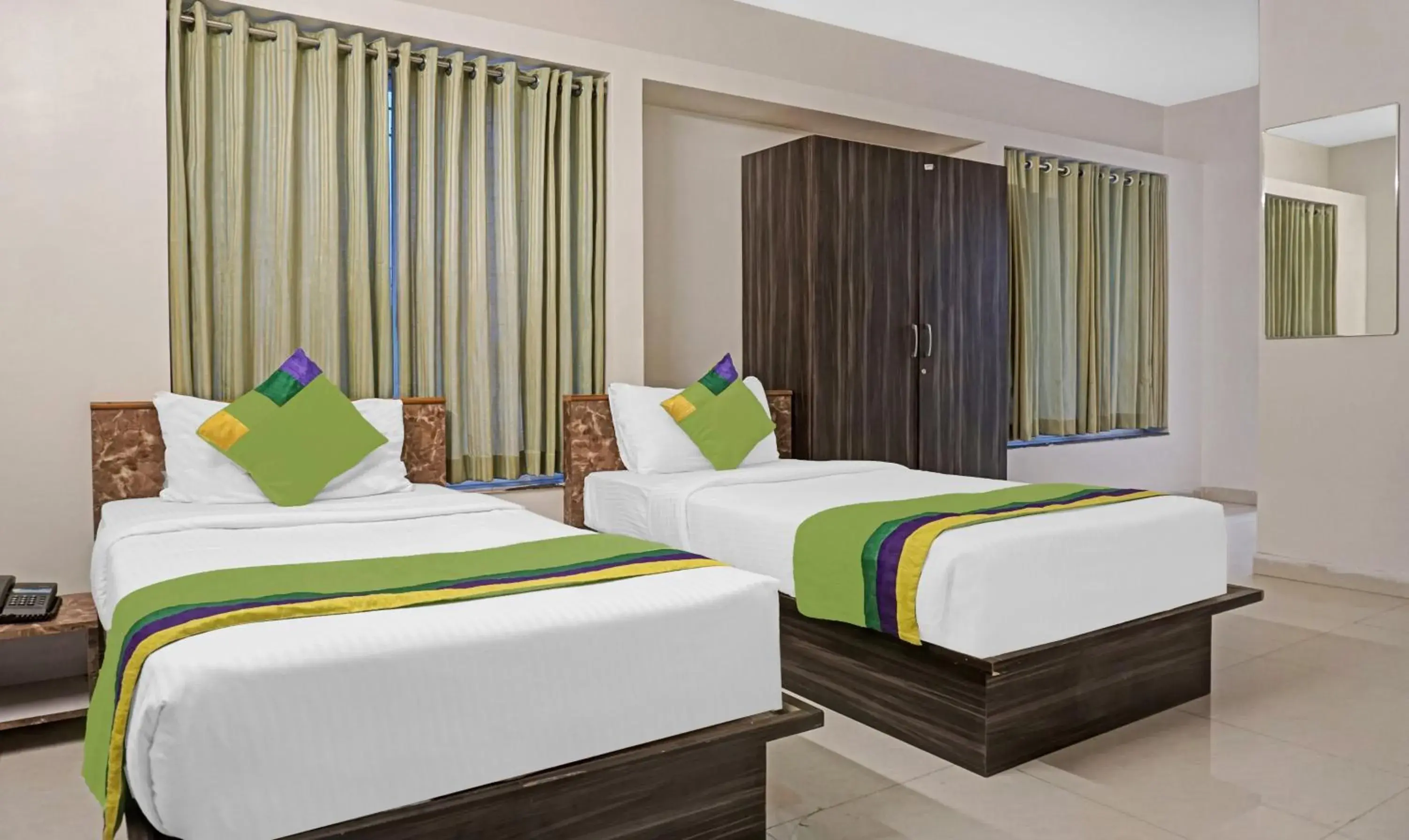 Bedroom, Bed in Treebo Diamond Residency - DDPK Inn Bedroom, Bed in Treebo Diamond Residency - DDPK Inn