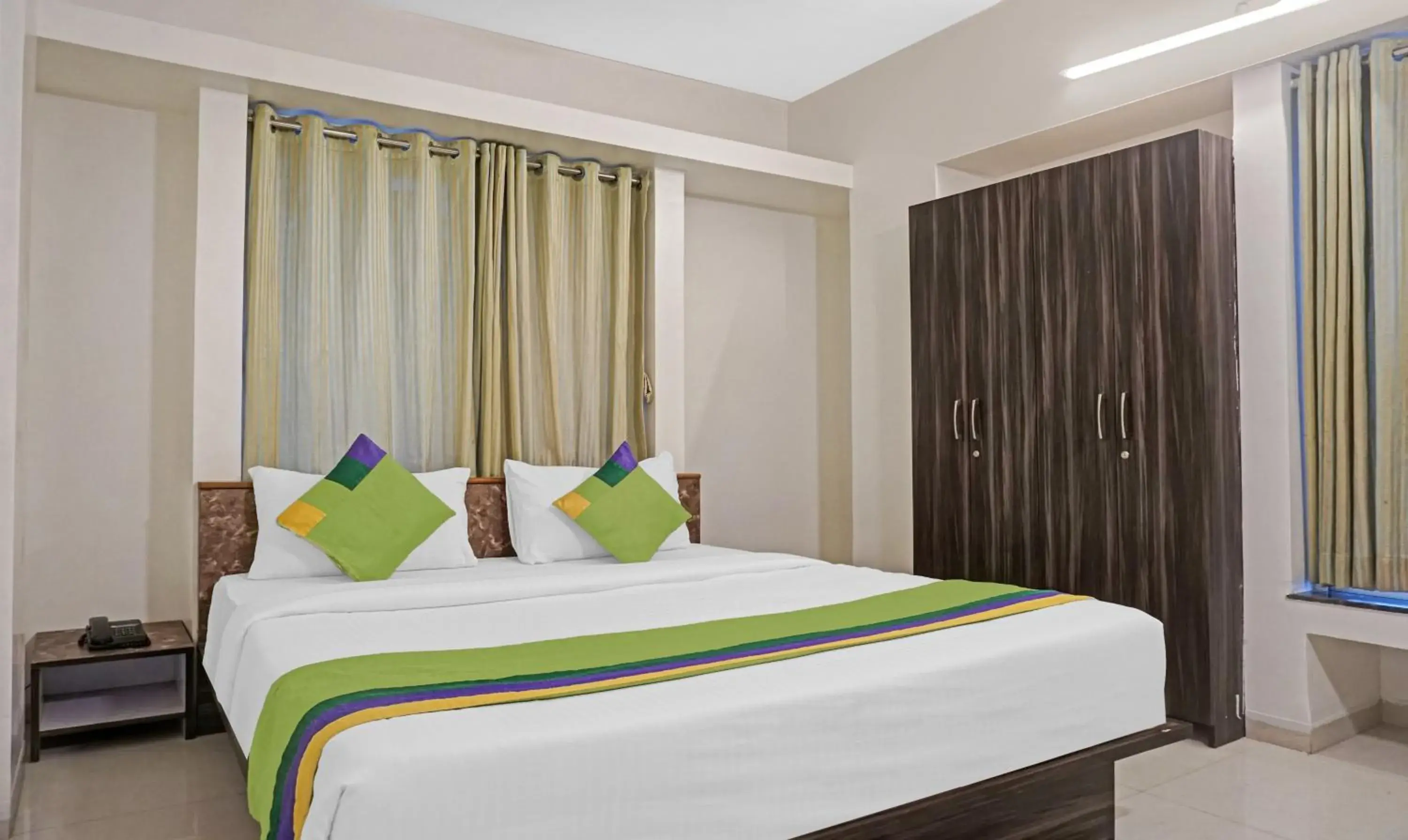 Bedroom, Bed in Treebo Diamond Residency - DDPK Inn Bedroom, Bed in Treebo Diamond Residency - DDPK Inn