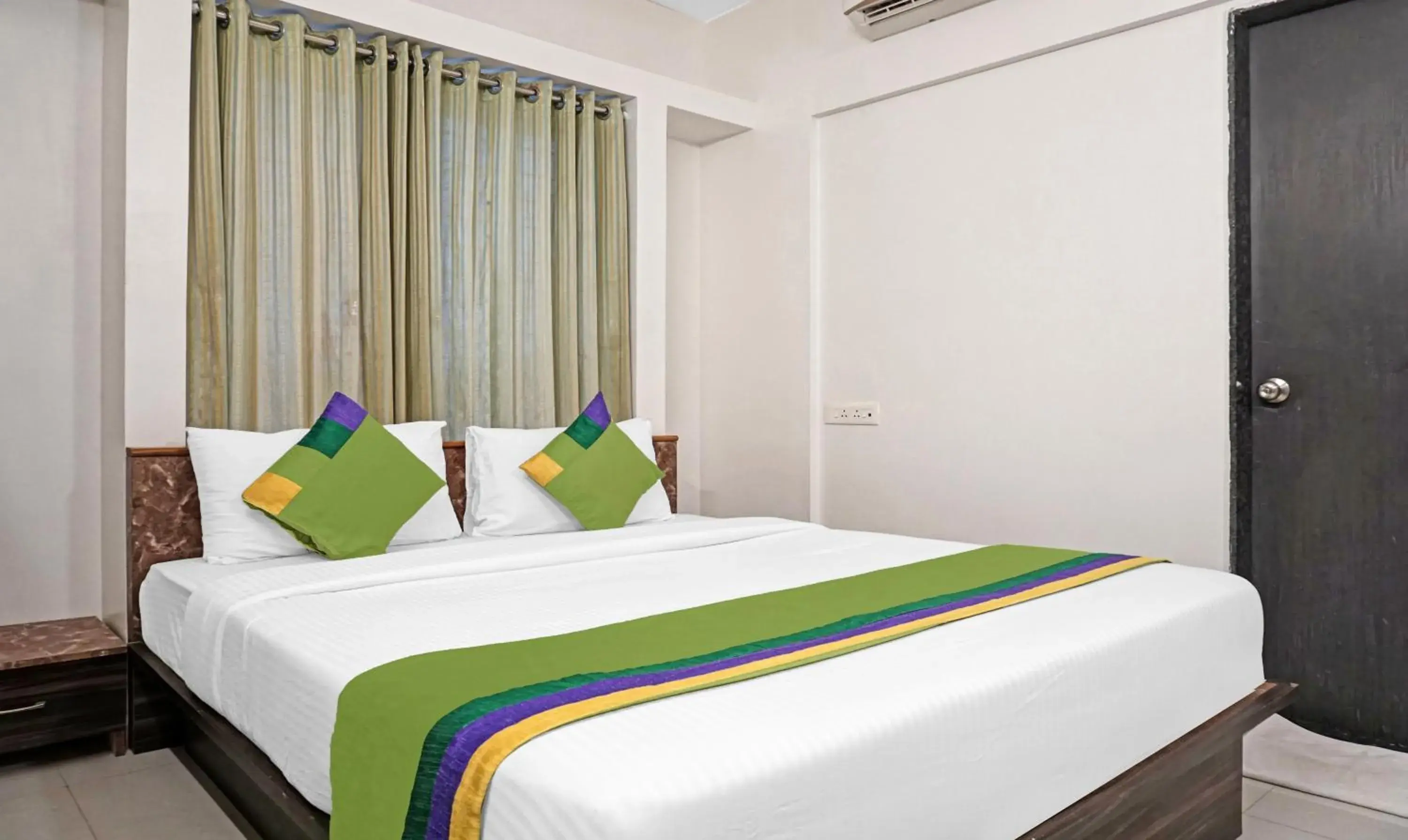 Bedroom, Bed in Treebo Diamond Residency - DDPK Inn Bedroom, Bed in Treebo Diamond Residency - DDPK Inn