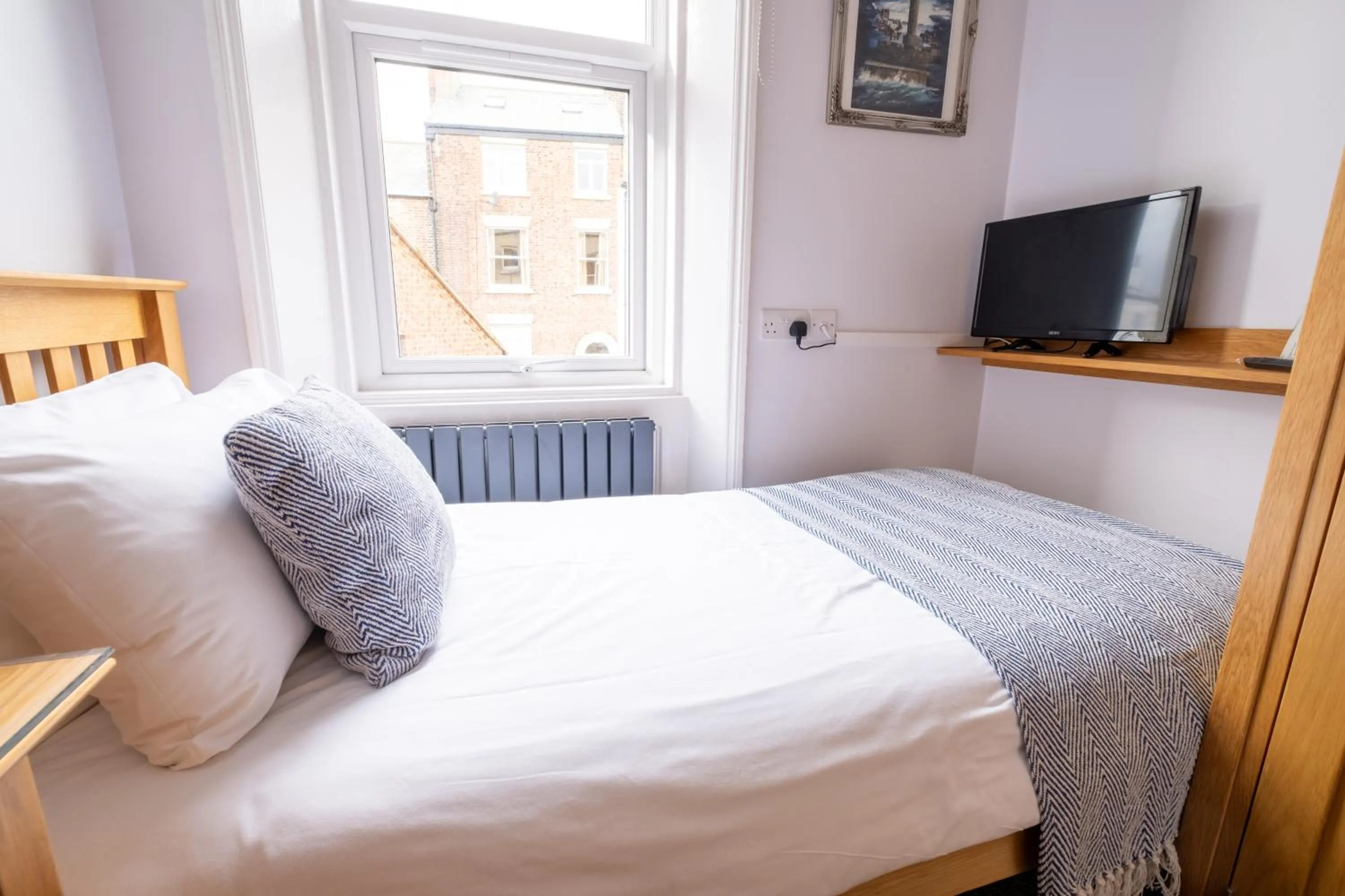 Photo of the whole room, Bed in Number 7 Guest House