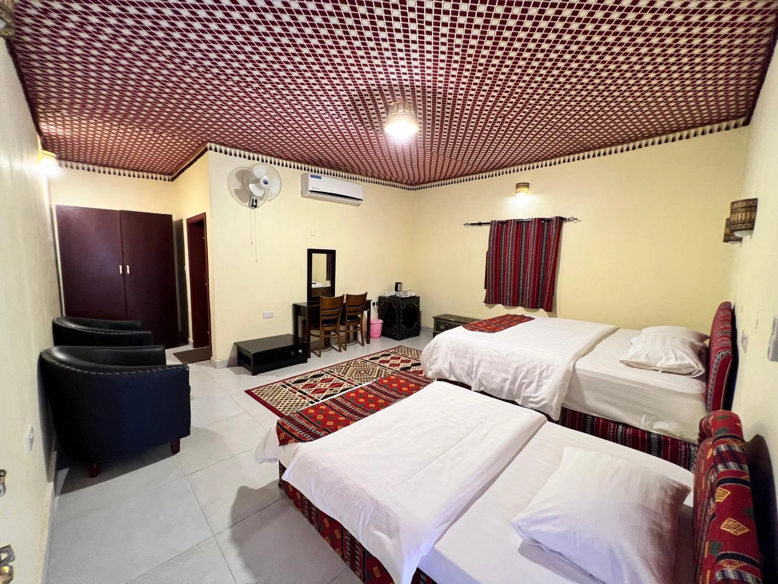 Bed in Arabian Oryx Camp