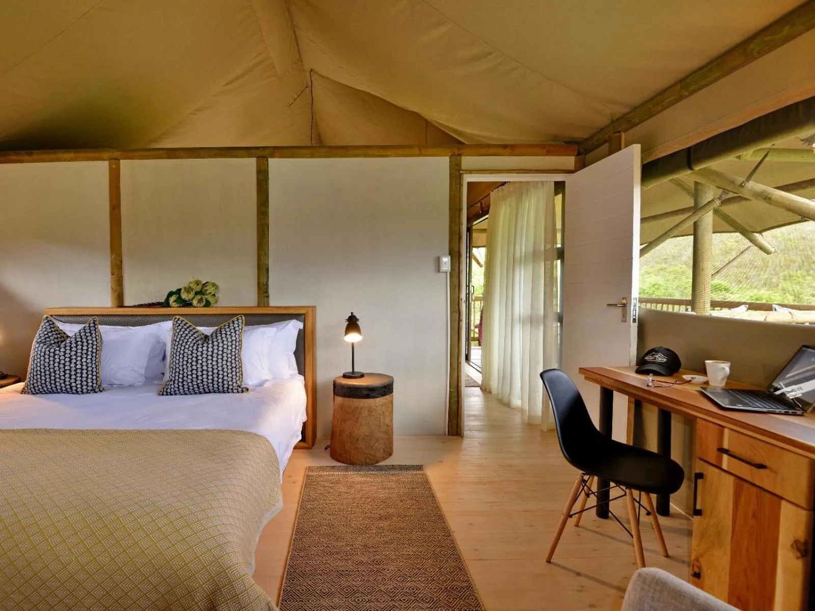 Bed in Garden Route Safari Camp