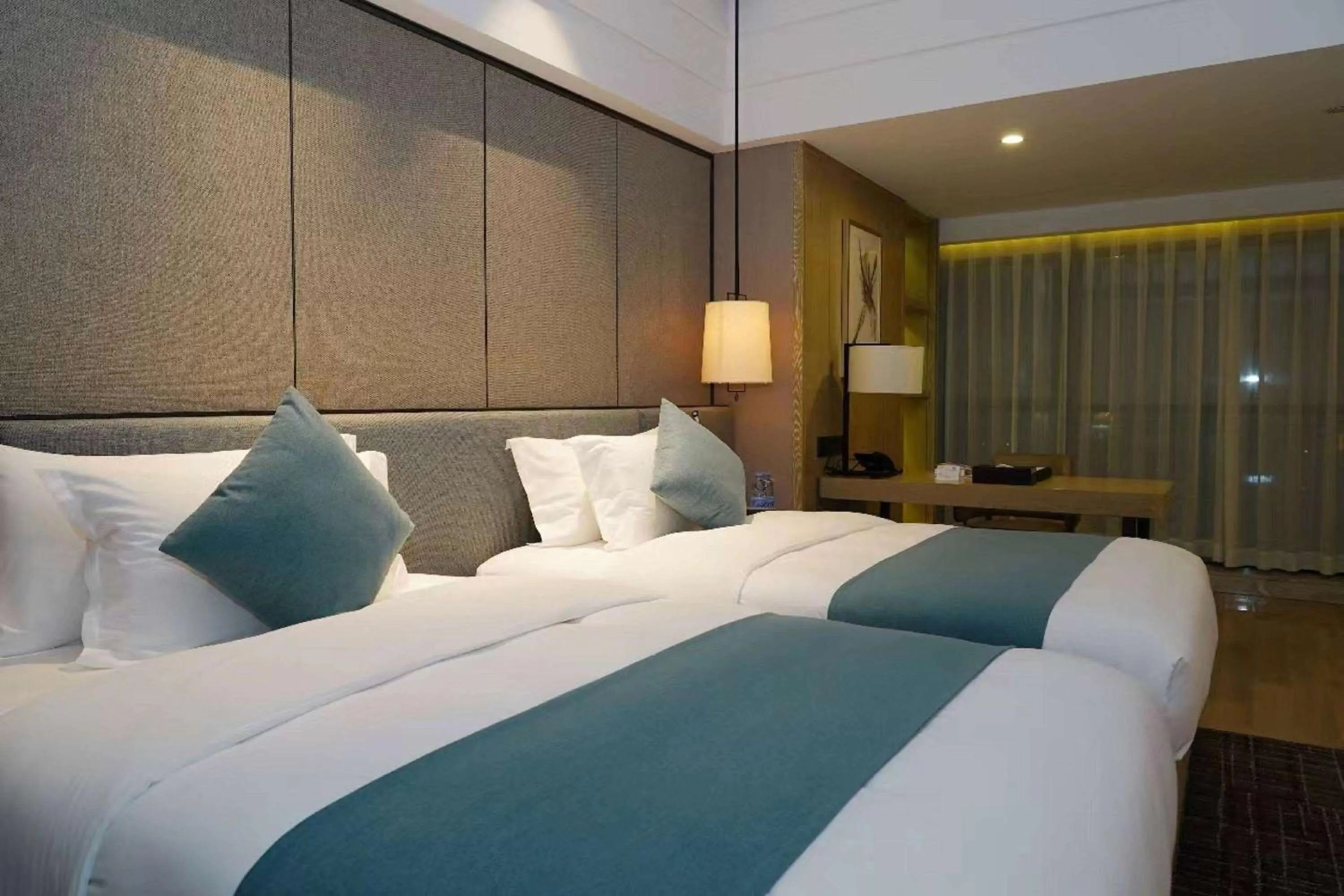 Photo of the whole room, Bed in Wyndham Grand Maoming