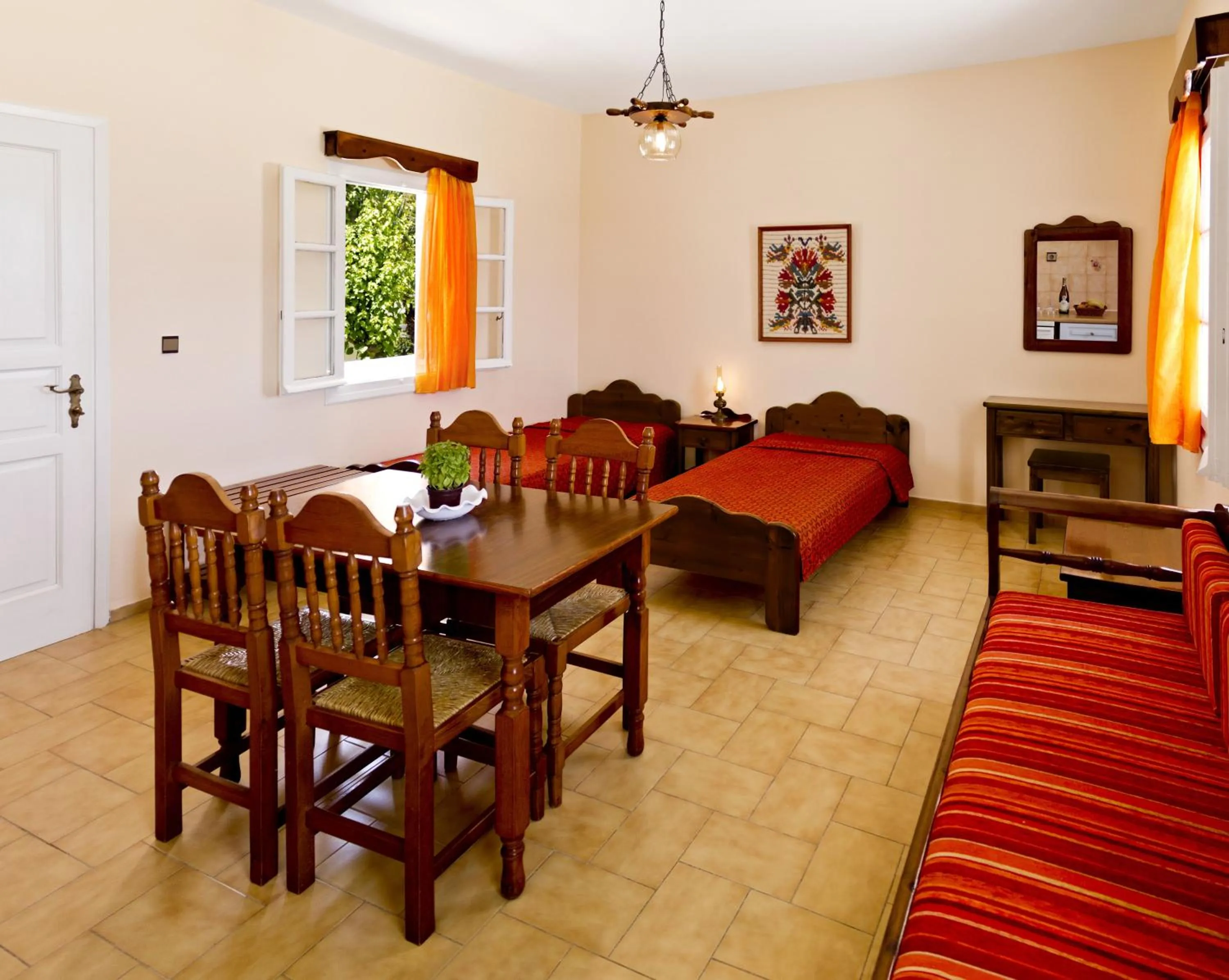 Dining area, Bed in Dolphins Apartments