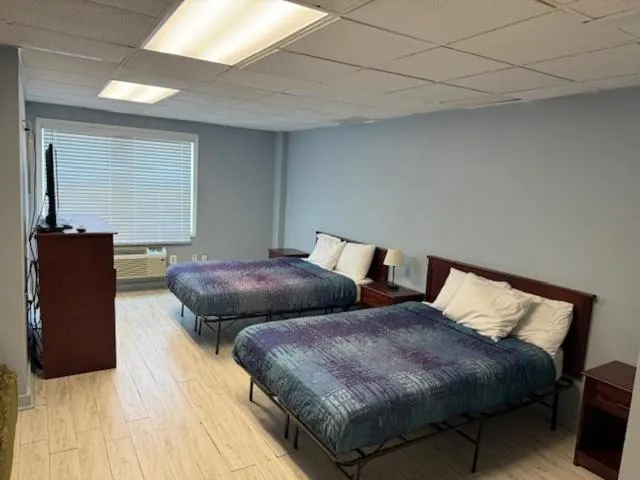 Bed in Hammock Inn & Suites North Beach Hotel