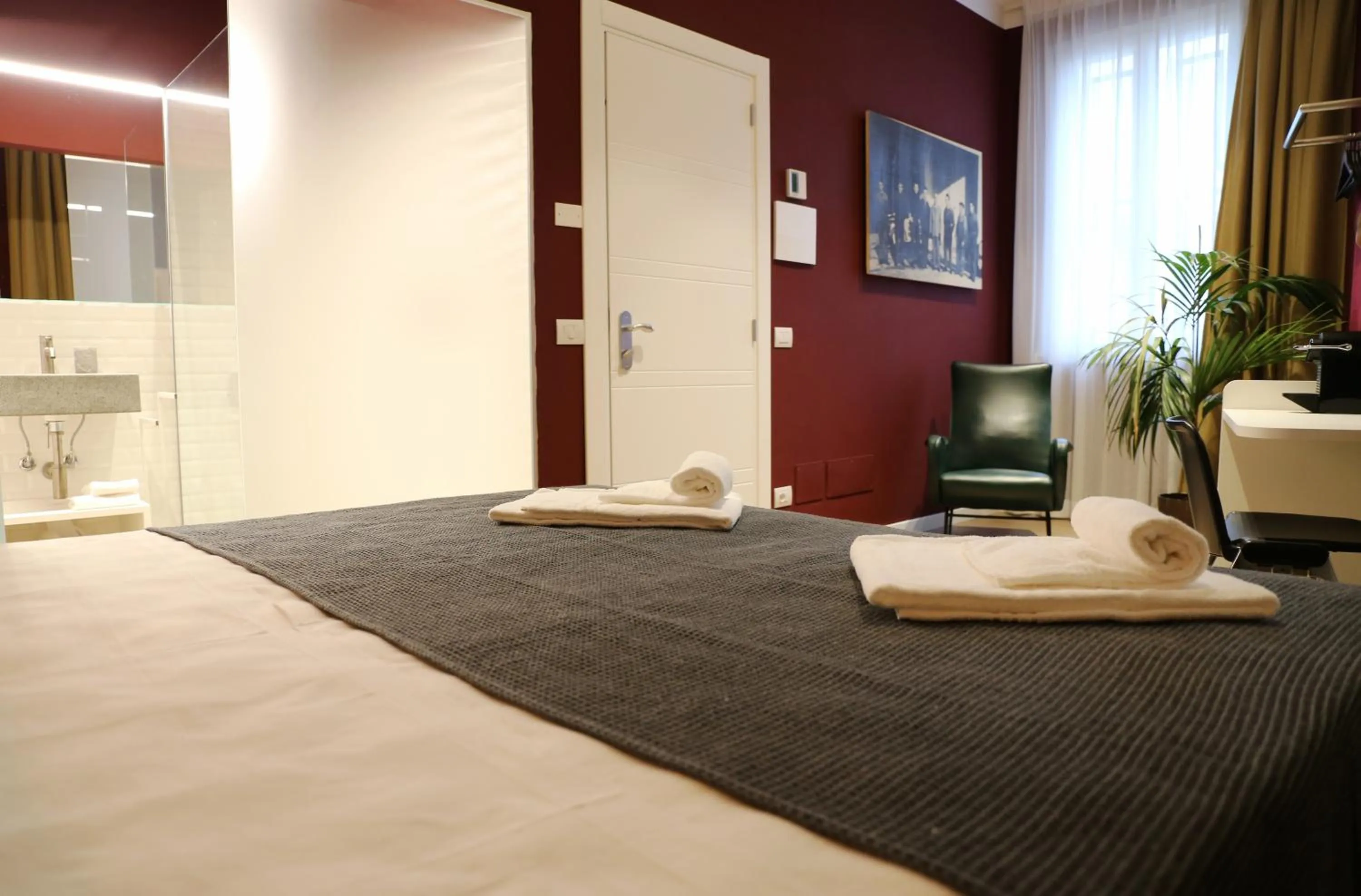 Bed in OFFICINA TESINI Guest Rooms Verona