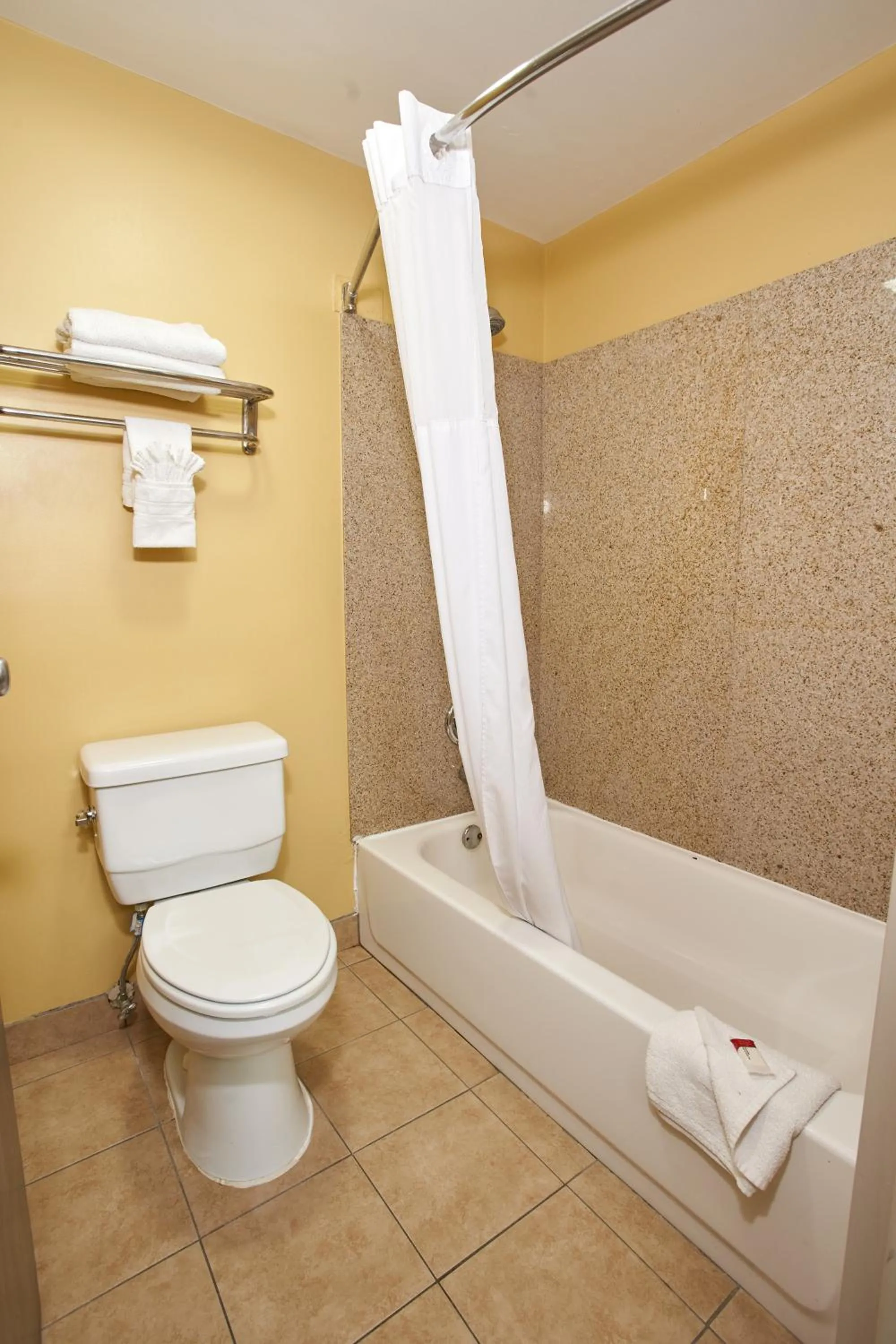 Toilet in Super 8 by Wyndham Wichita Airport West Kellogg