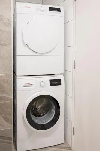 washing machine in The Edgerley Suites