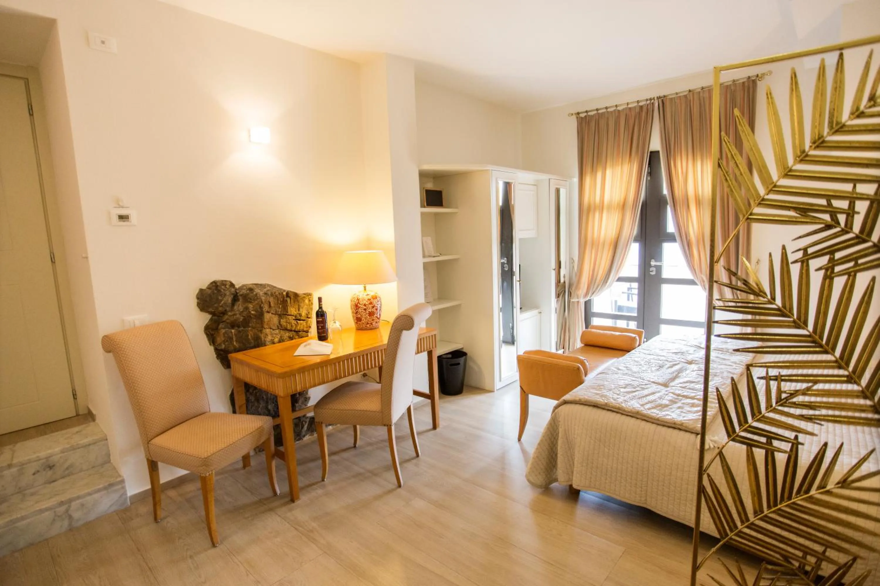 Bed in Miramare Apartments&Suites