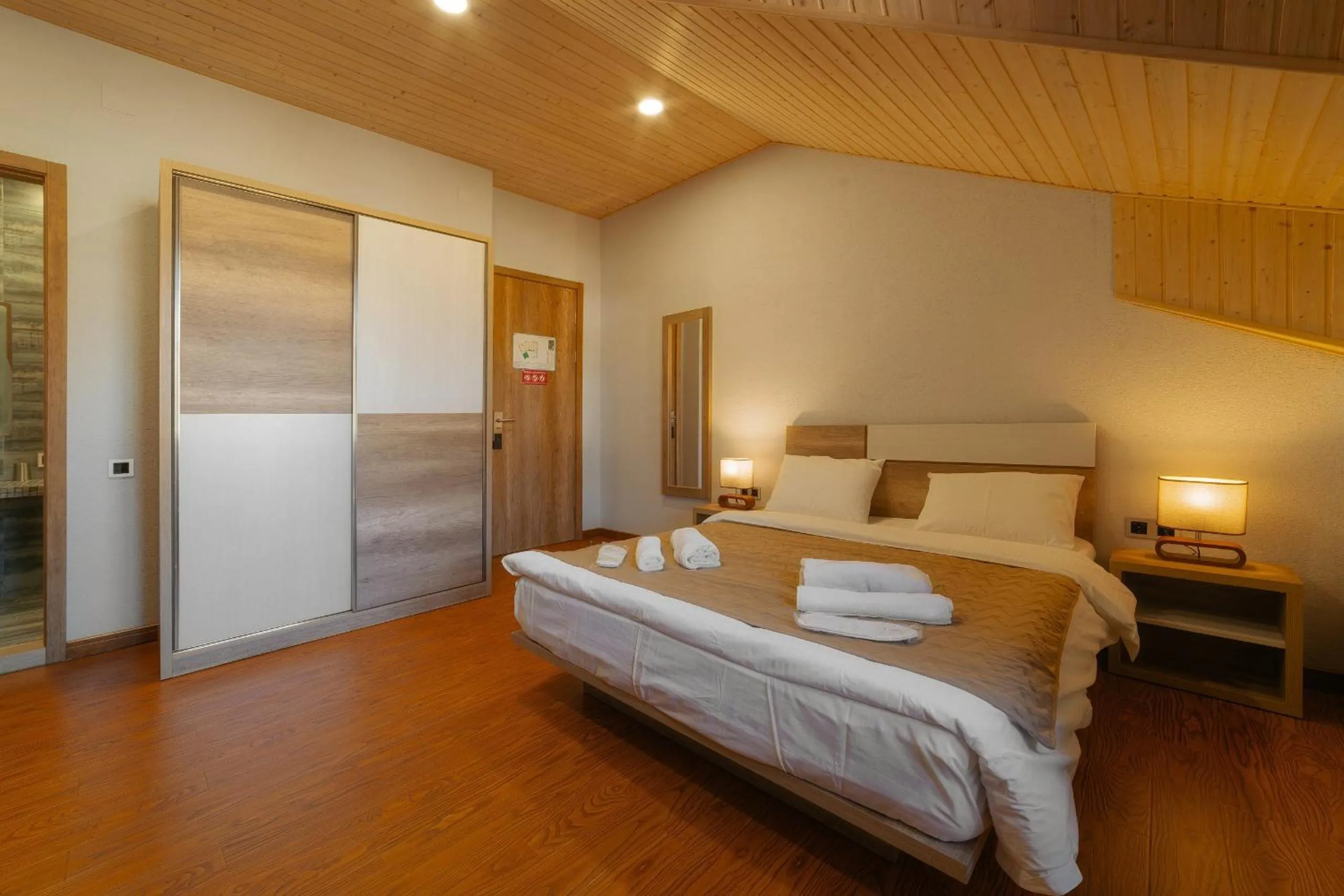 Bed in Ereto Hotel by SnowTime