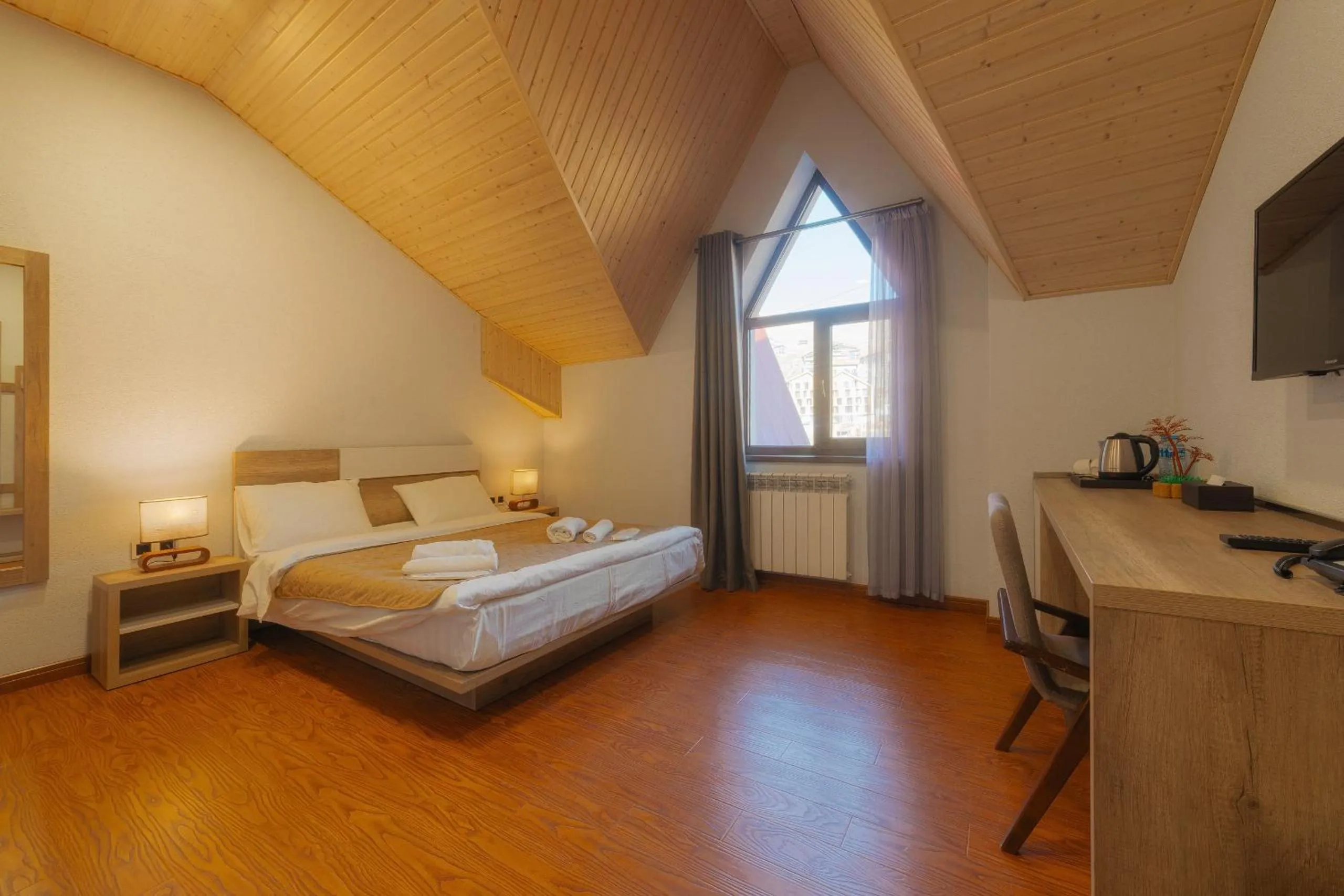 Bed in Ereto Hotel by SnowTime