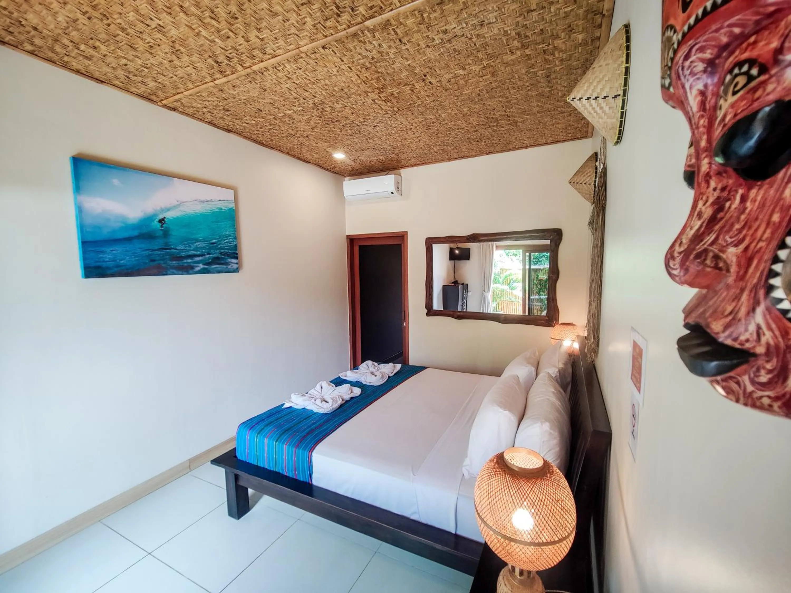 Bed in Ekas Surf Resort & Surf Camp