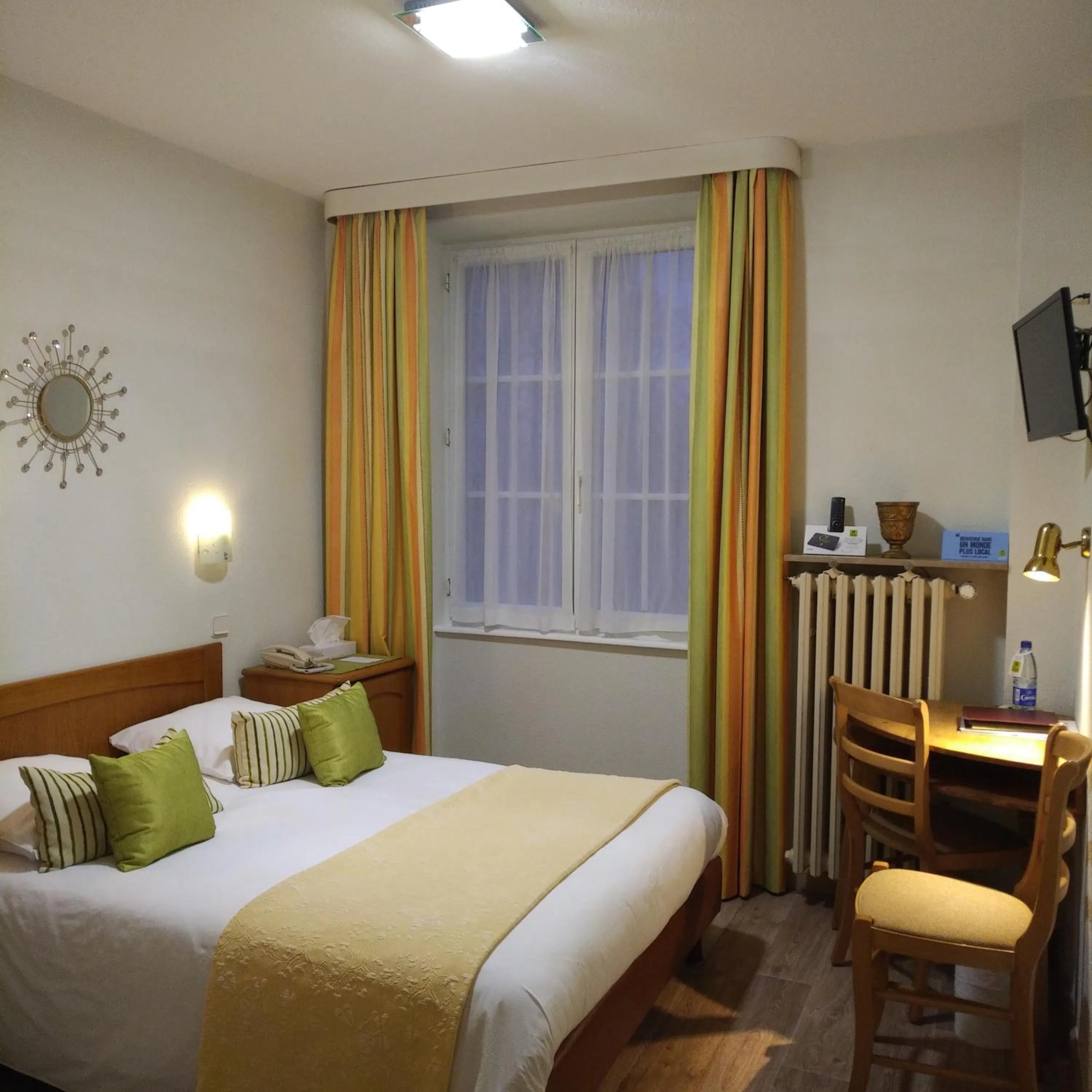 Decorative detail, Bed in Logis Hôtel Notre-Dame - restaurant ouvert midi et soir sauf dimanche soir