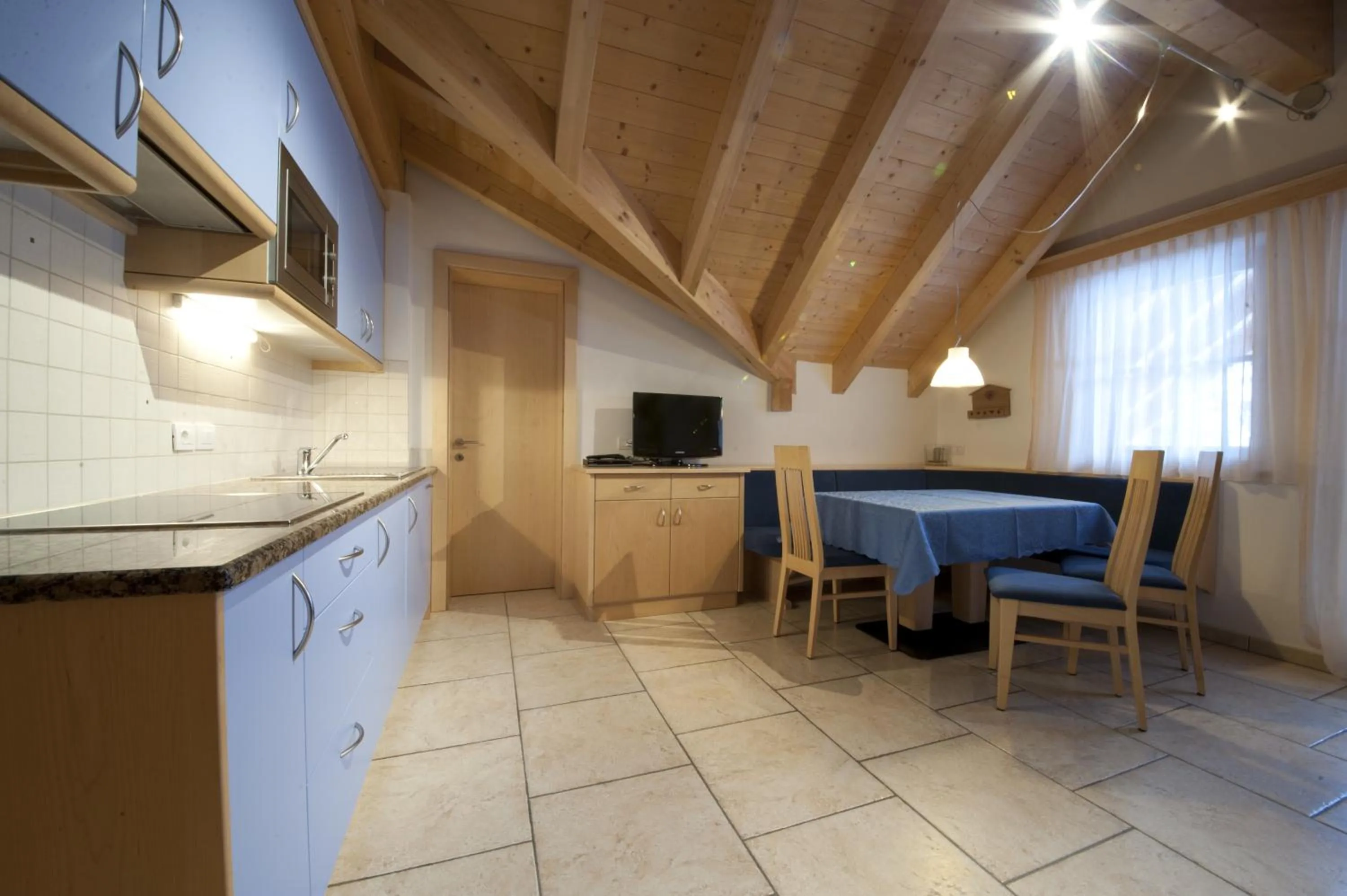 Kitchen or kitchenette in Appartamenti Villa Olympia