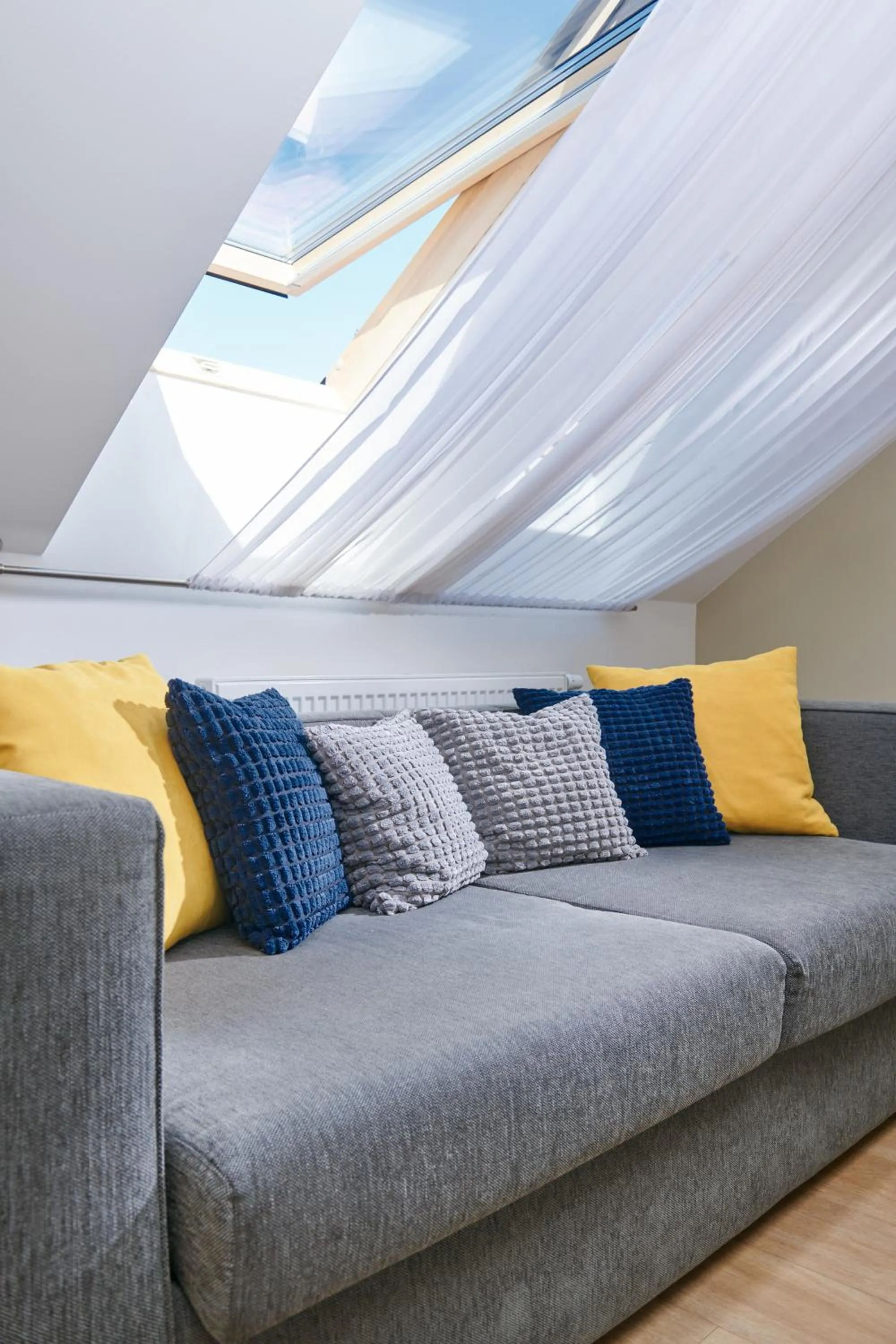 Seating area in City Nest Apartments by Adrez