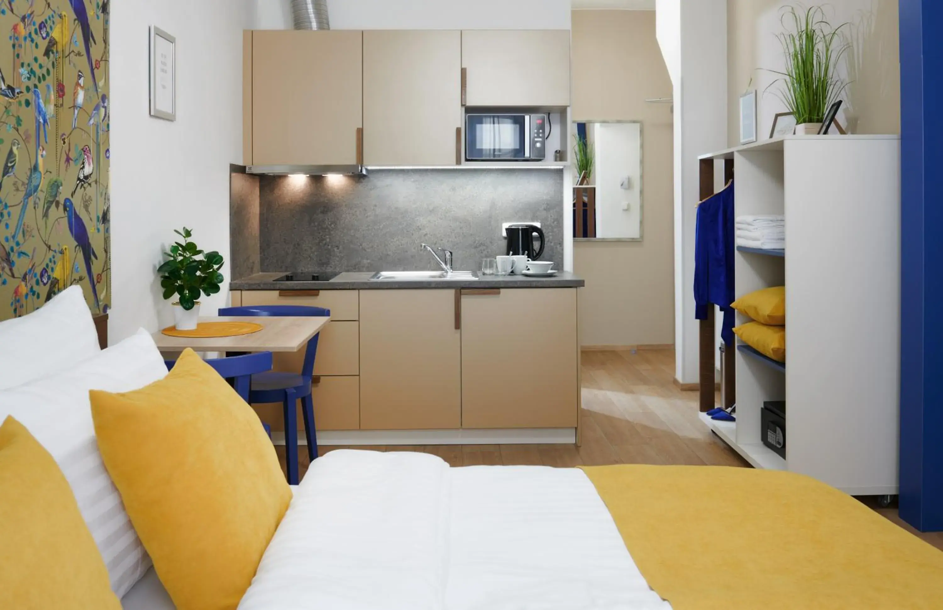 Kitchen or kitchenette, Bed in City Nest Apartments by Adrez Kitchen or kitchenette, Bed in City Nest Apartments by Adrez