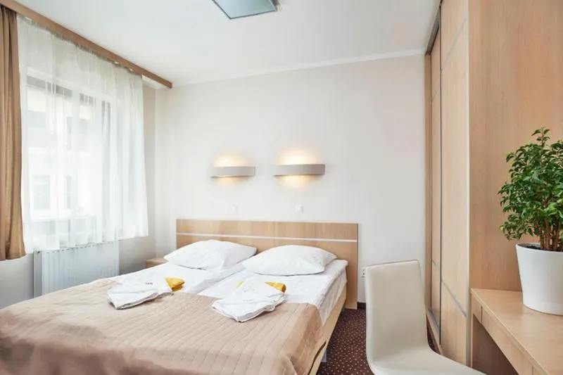 Photo of the whole room, Bed in Instytut Zdrowia Sofra FIT & SPA