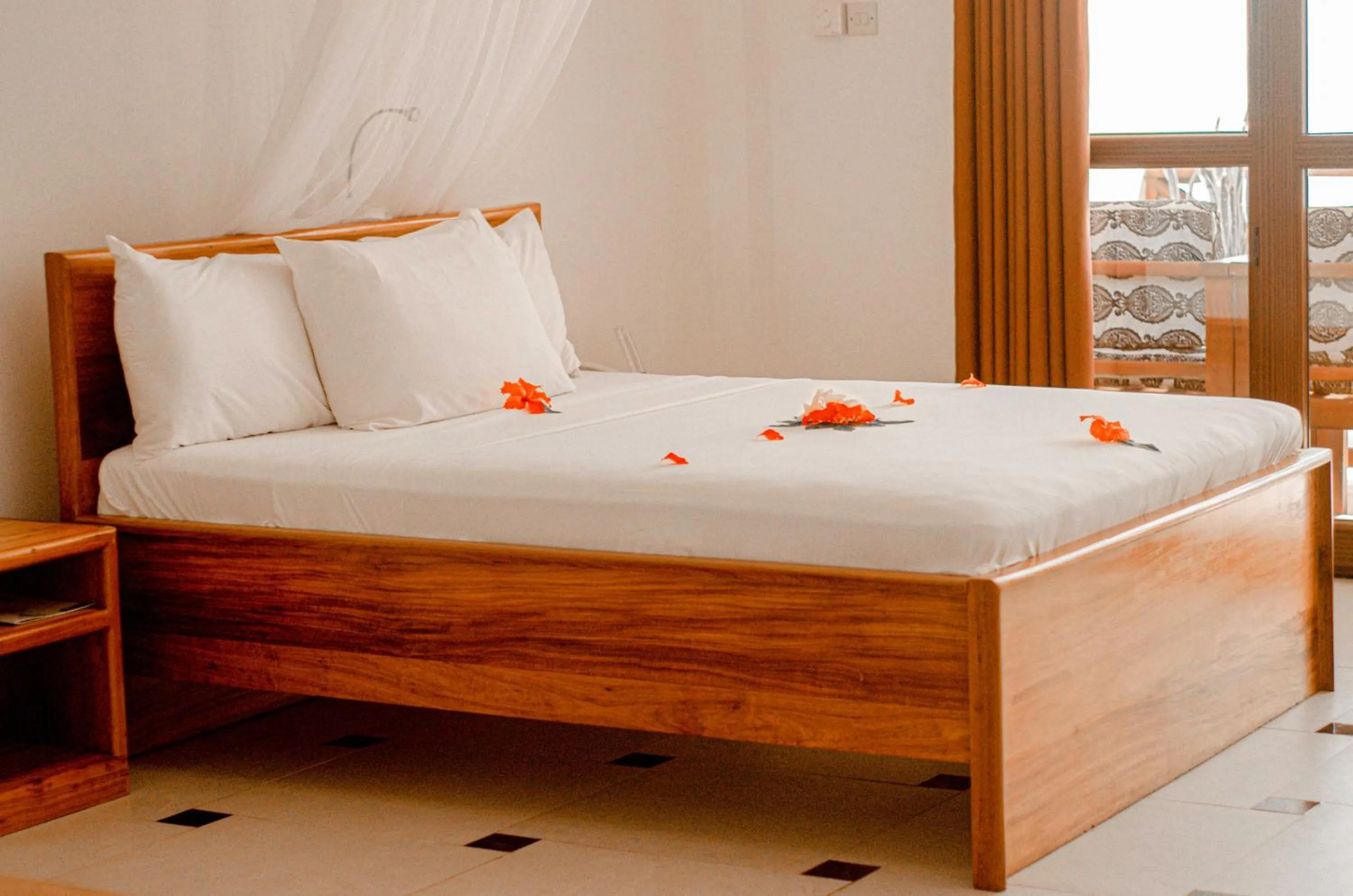 Bed in Mnarani Beach Cottages