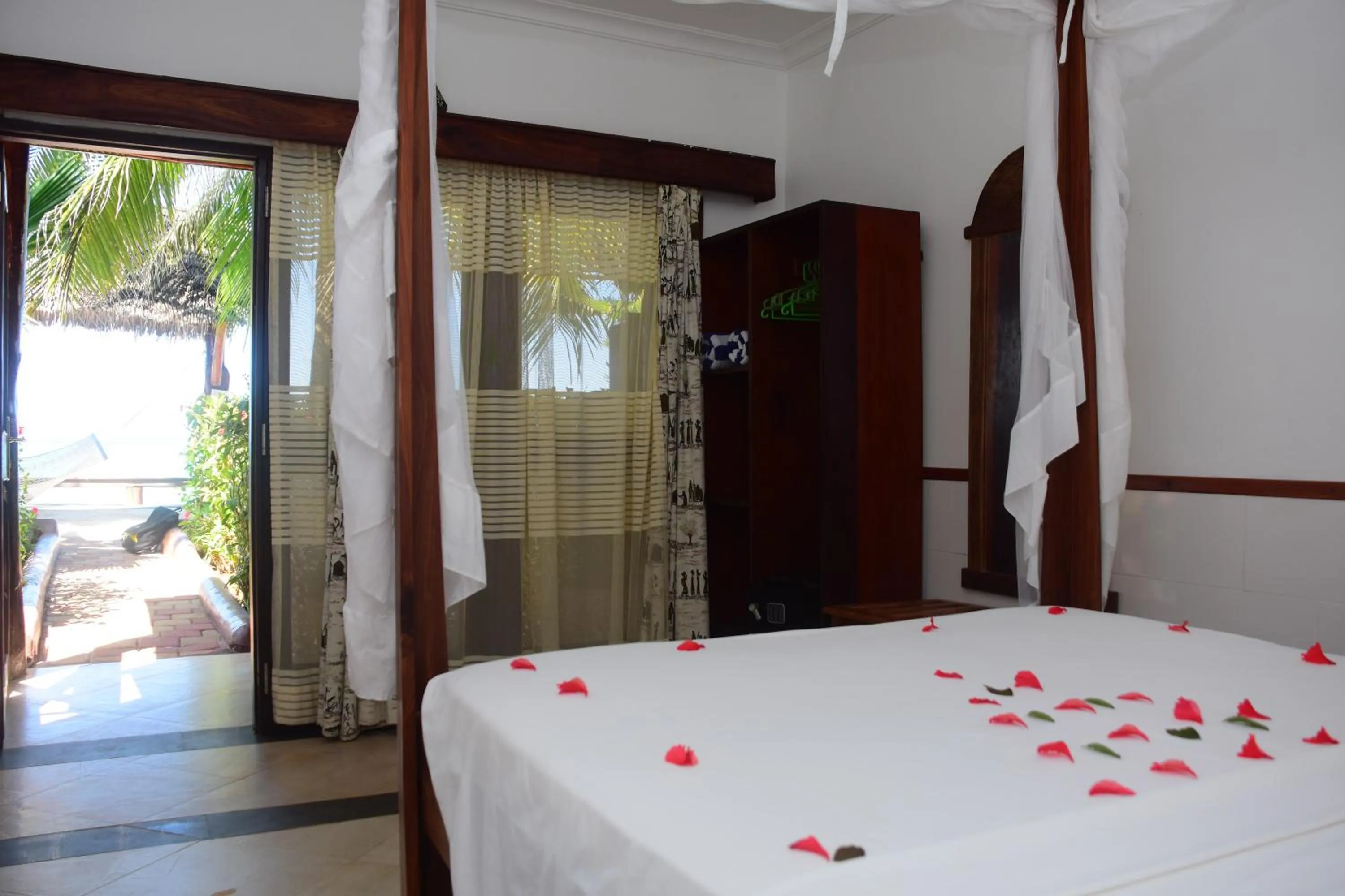 Photo of the whole room, Bed in Mnarani Beach Cottages