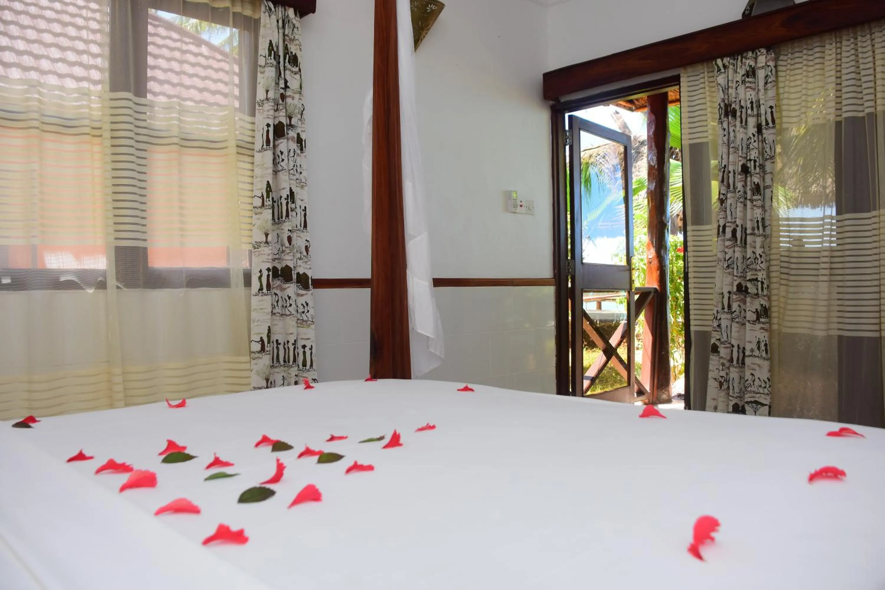 Photo of the whole room, Bed in Mnarani Beach Cottages