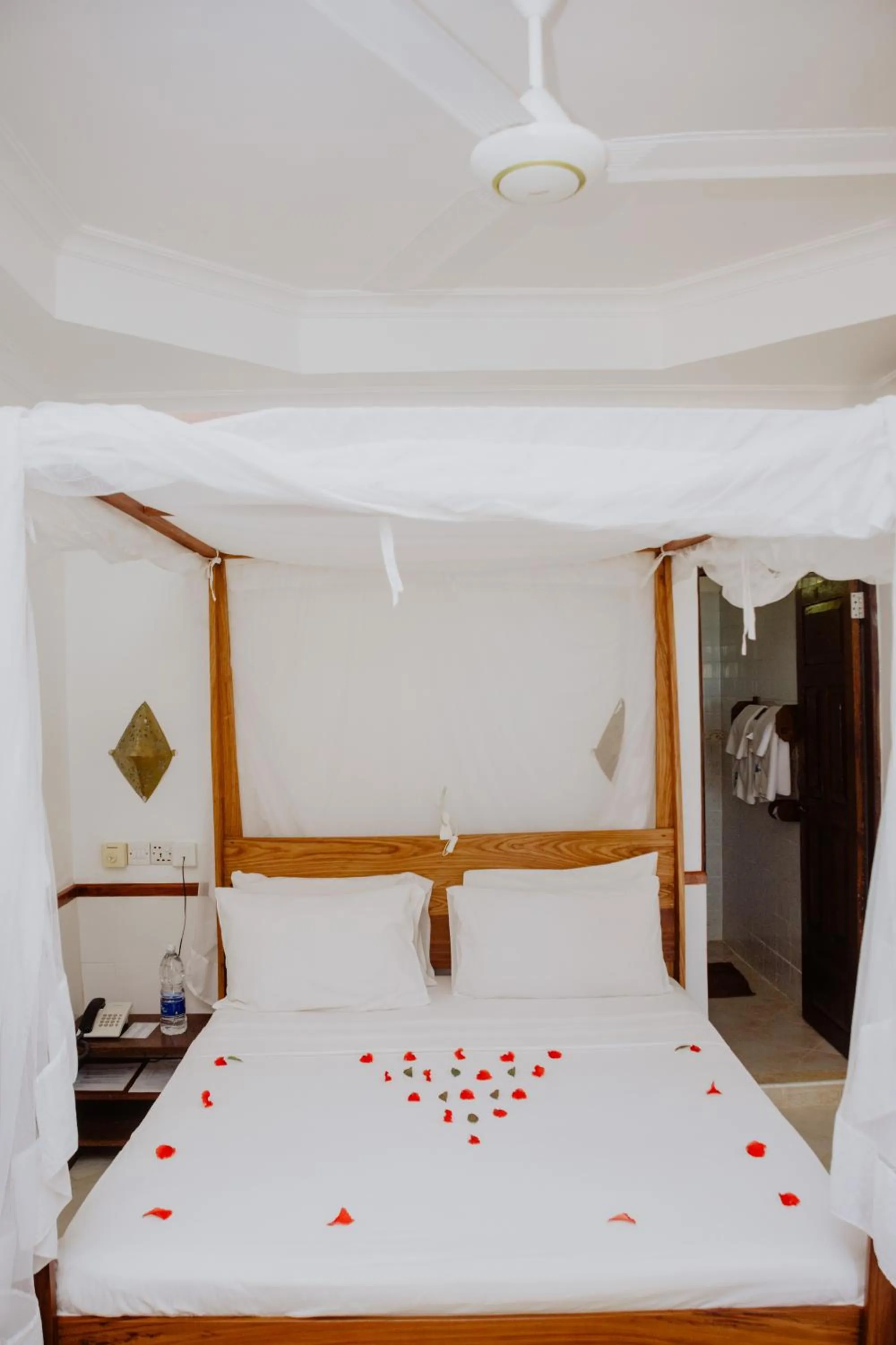 Bed in Mnarani Beach Cottages