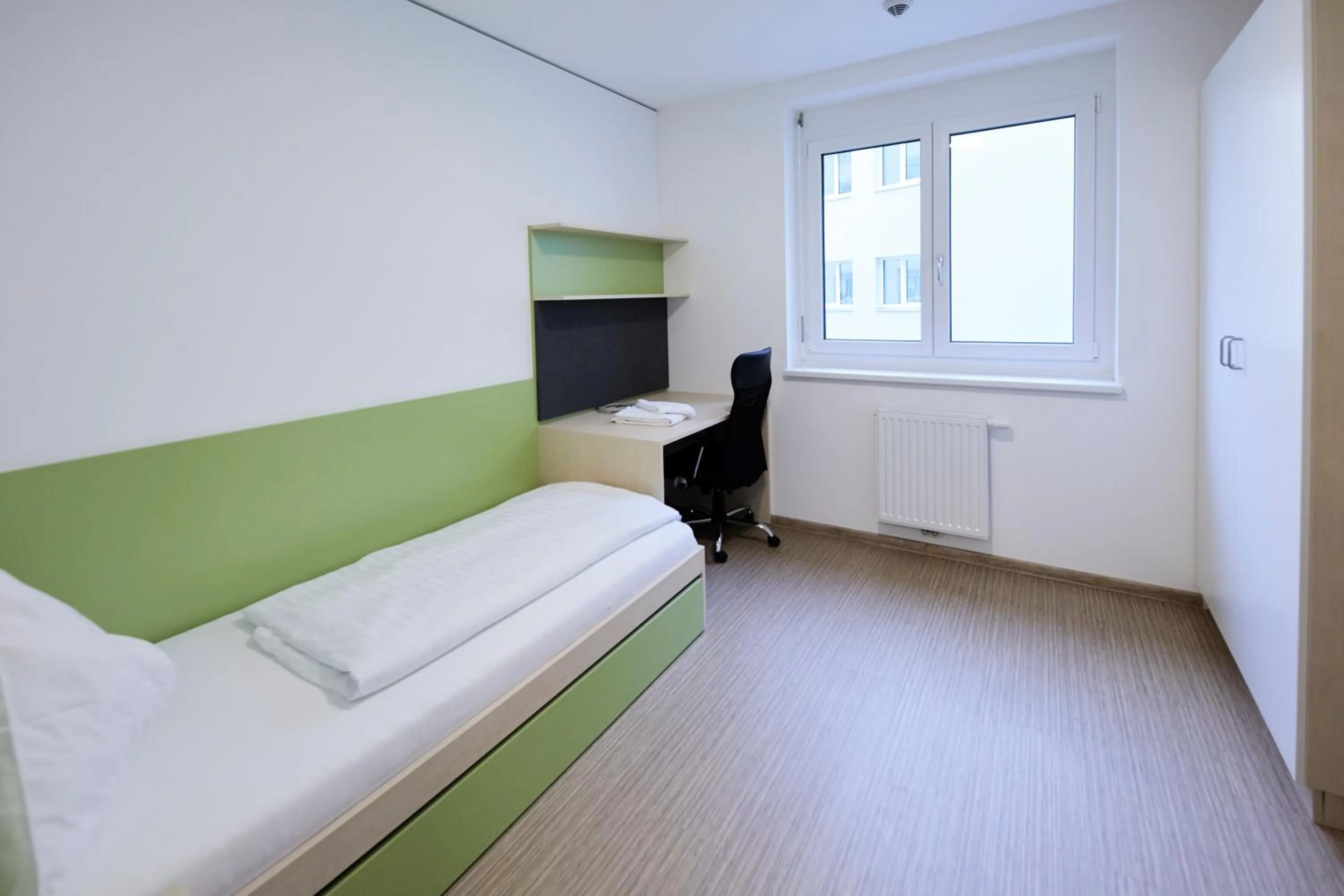 Bed in I AM HOTEL Leoben