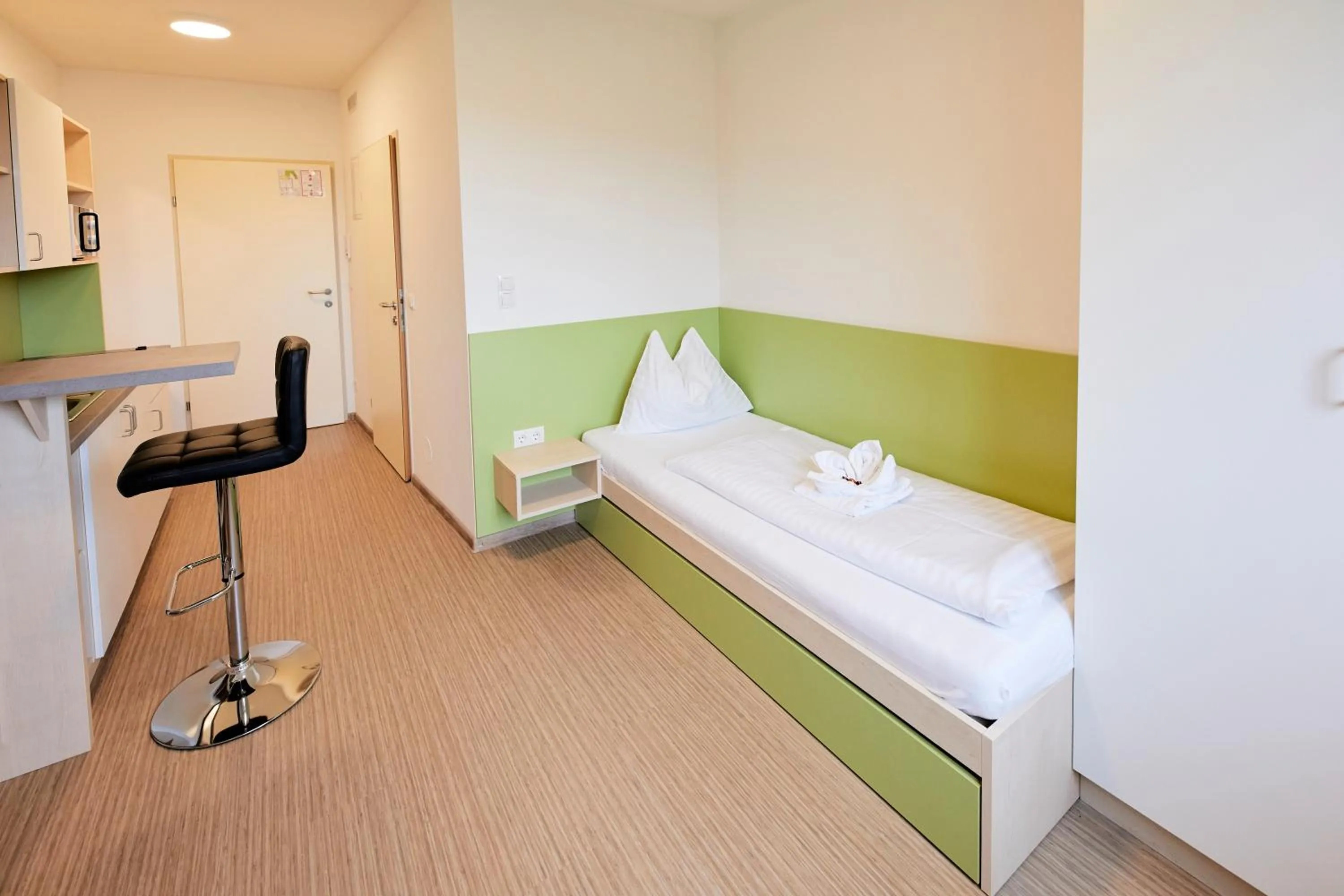Photo of the whole room, Bed in I AM HOTEL Leoben