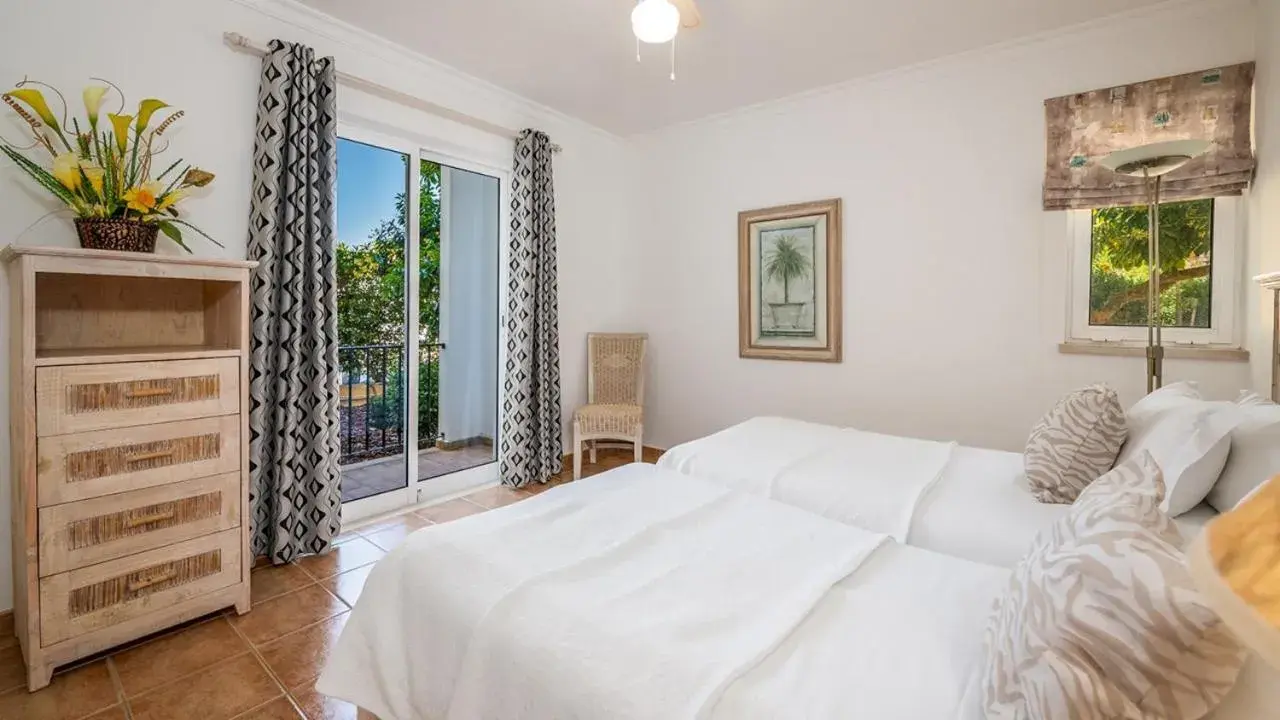 Bed in Jardim da Meia Praia Resort Bed in Jardim da Meia Praia Resort