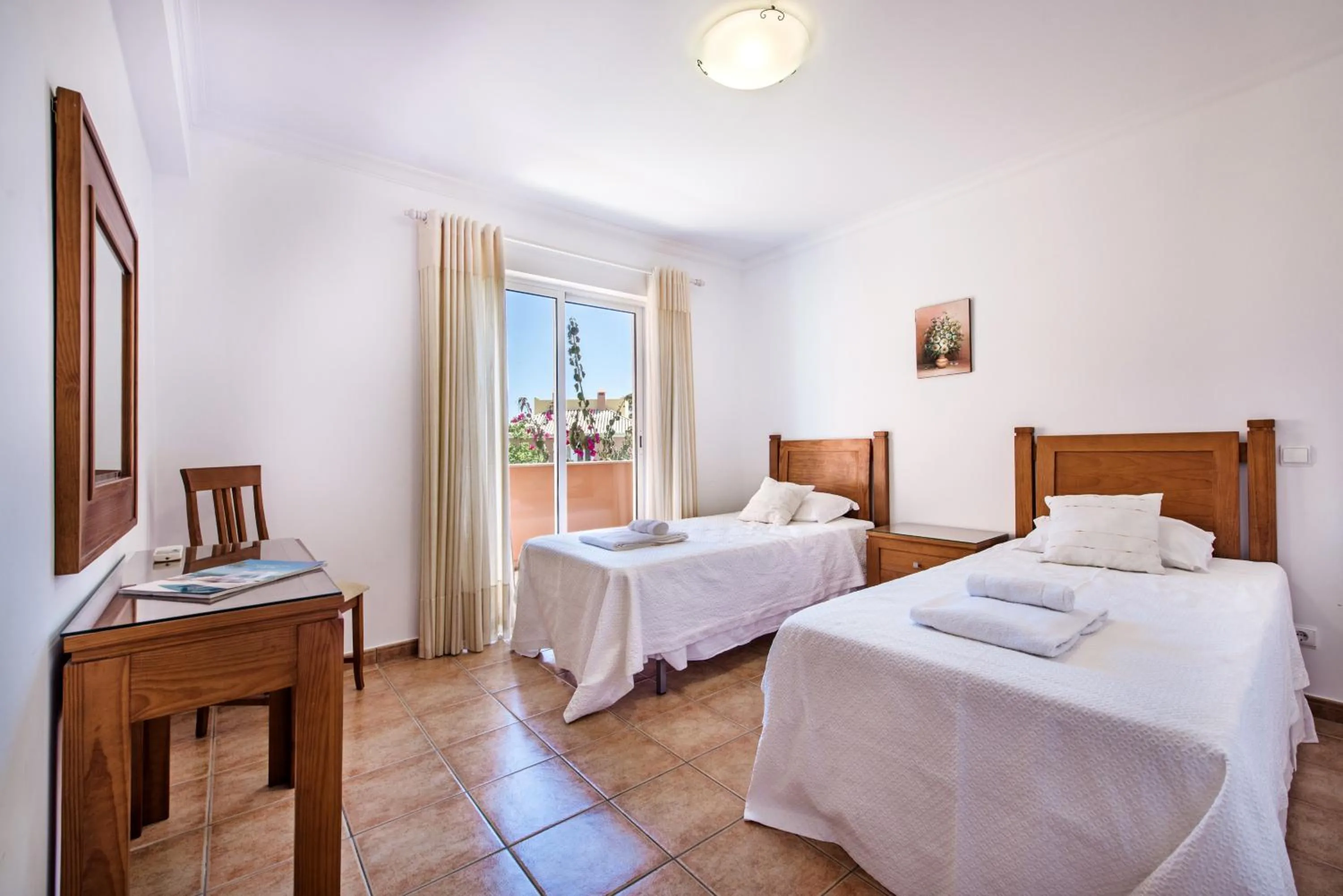 Bed in Jardim da Meia Praia Resort