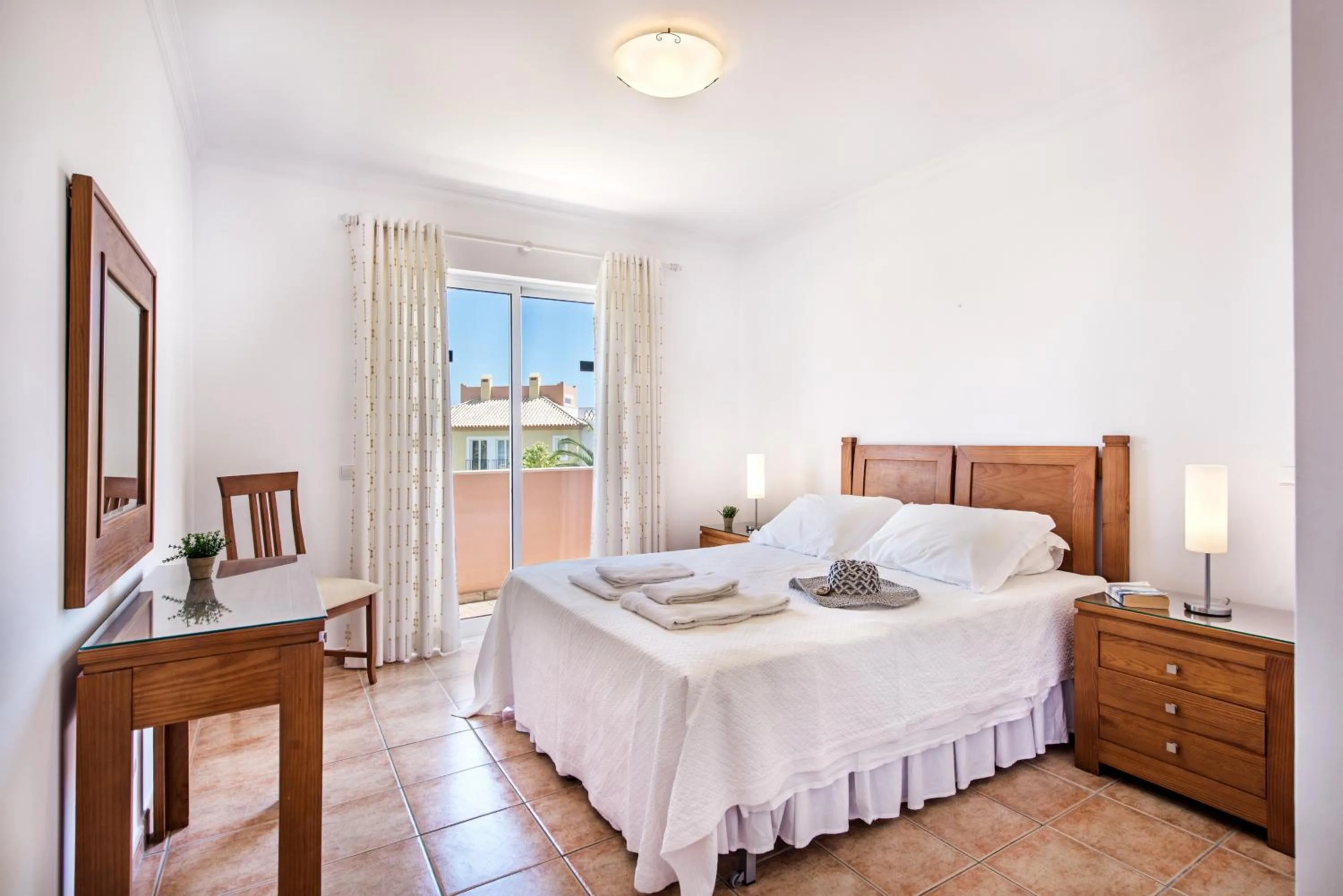 Bed in Jardim da Meia Praia Resort