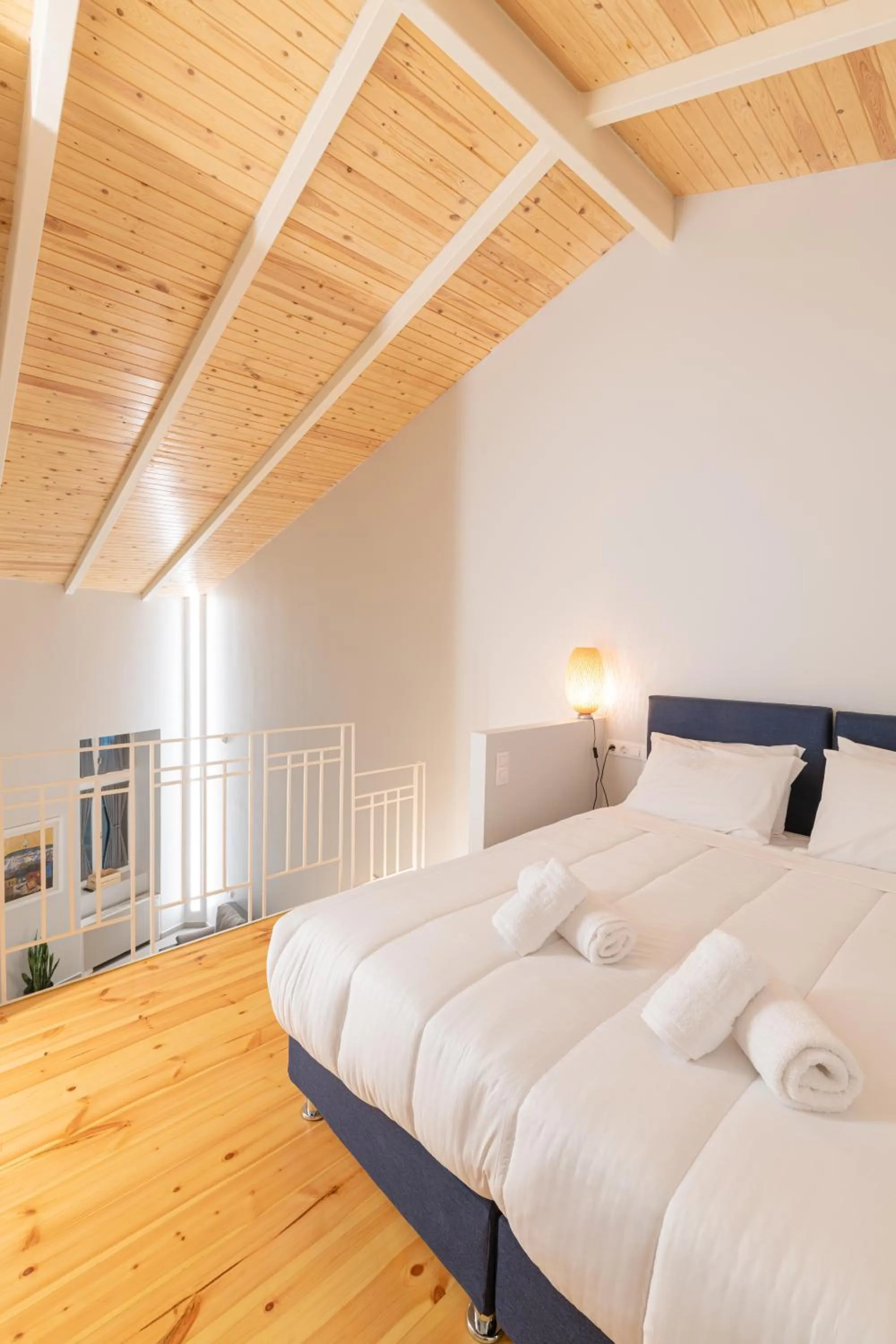 Bed in Ether Loft Suites