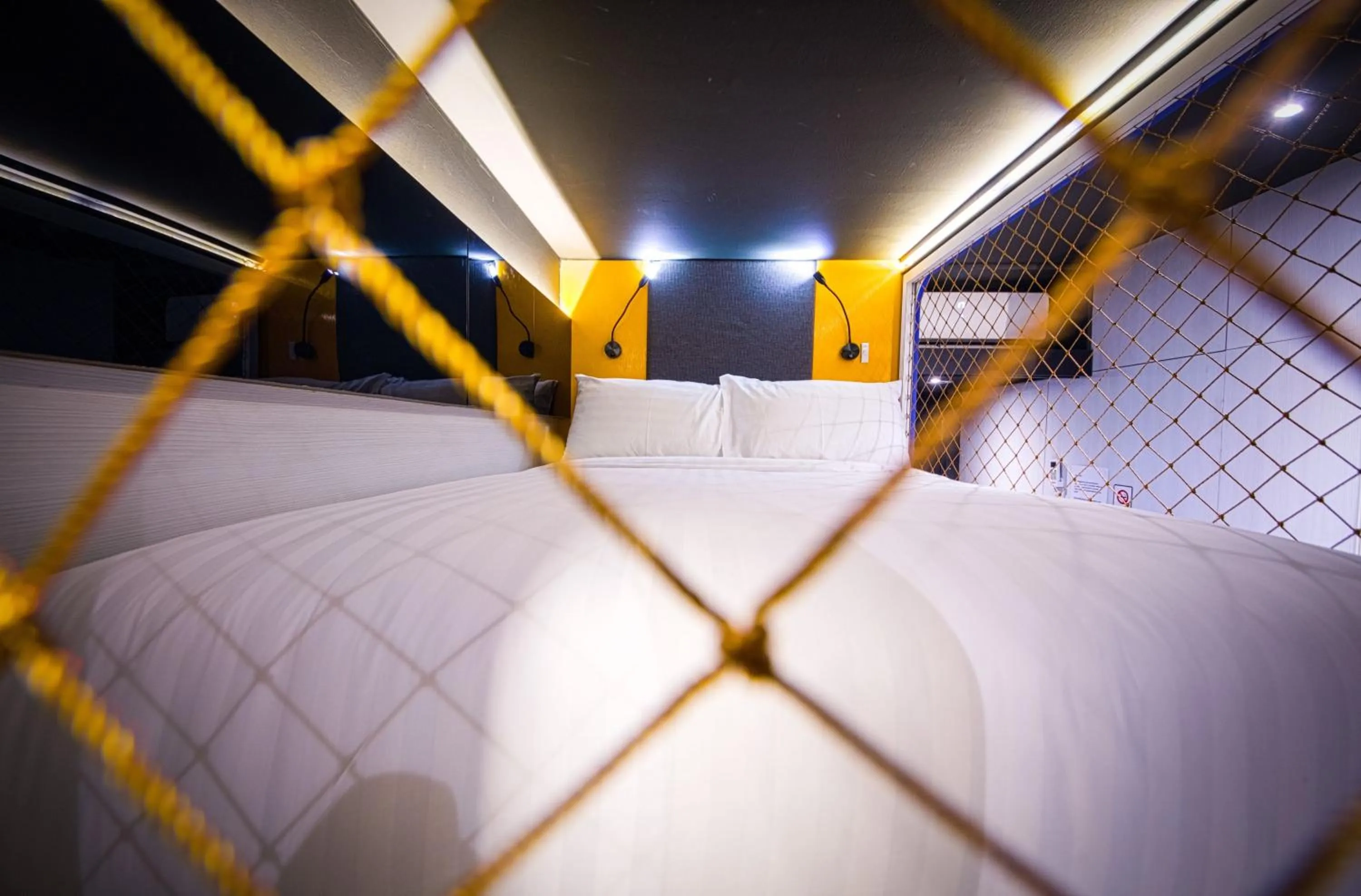 Bed in CUBE Family Boutique Capsule Hotel at Chinatown