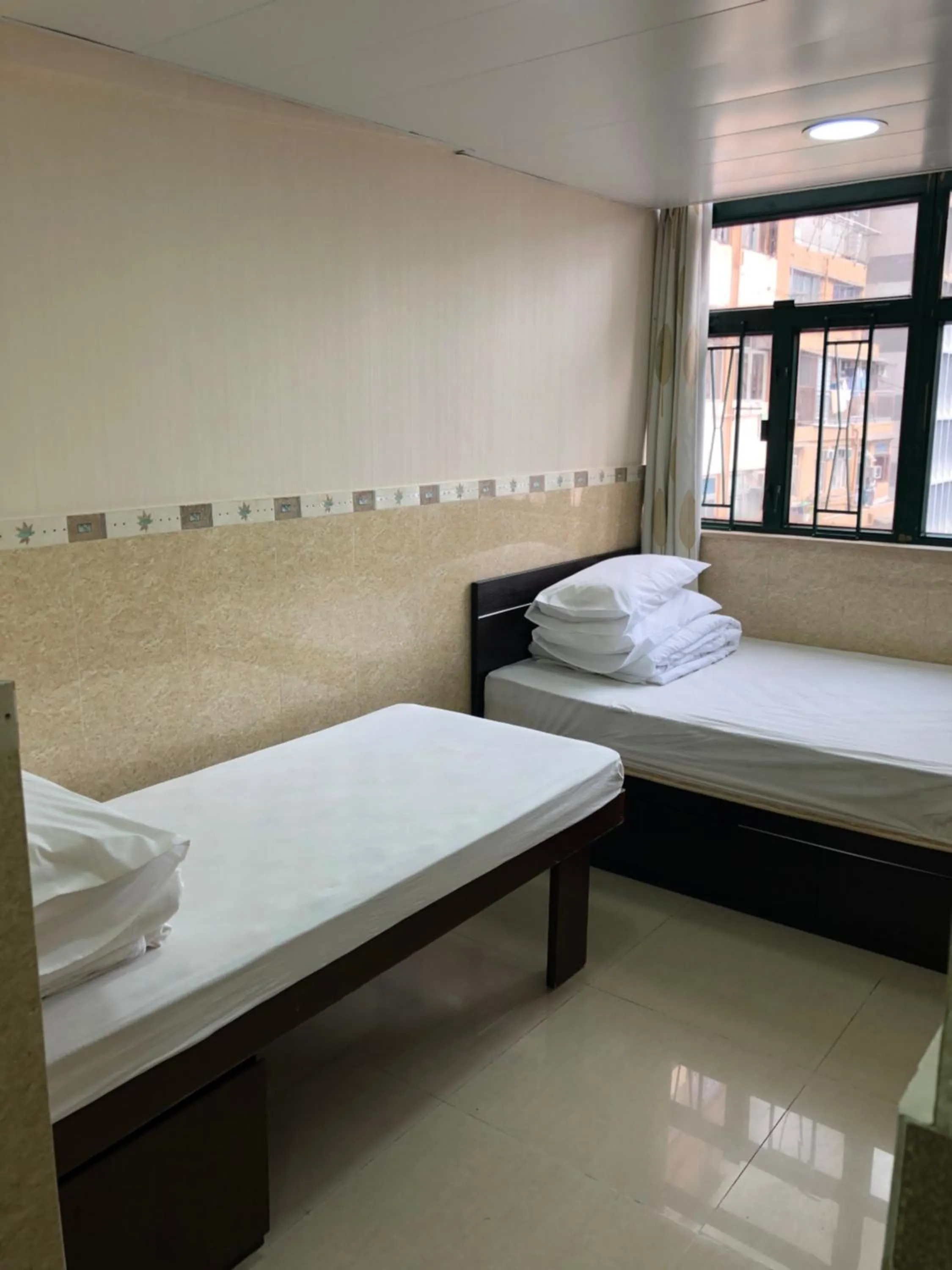 Bed in Hung Fai Guest House