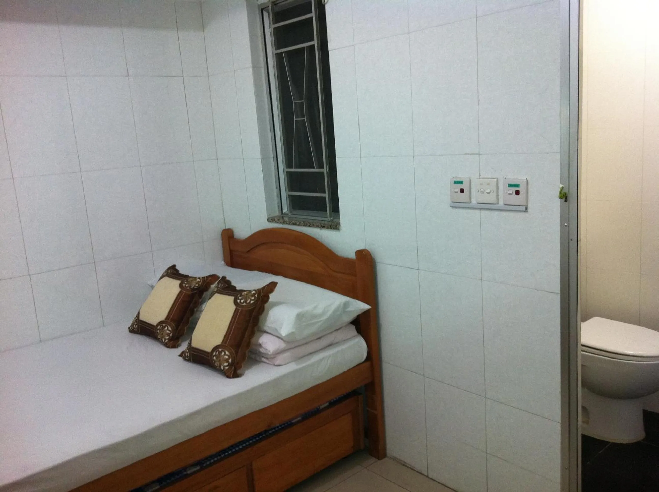 Bed in Hung Fai Guest House