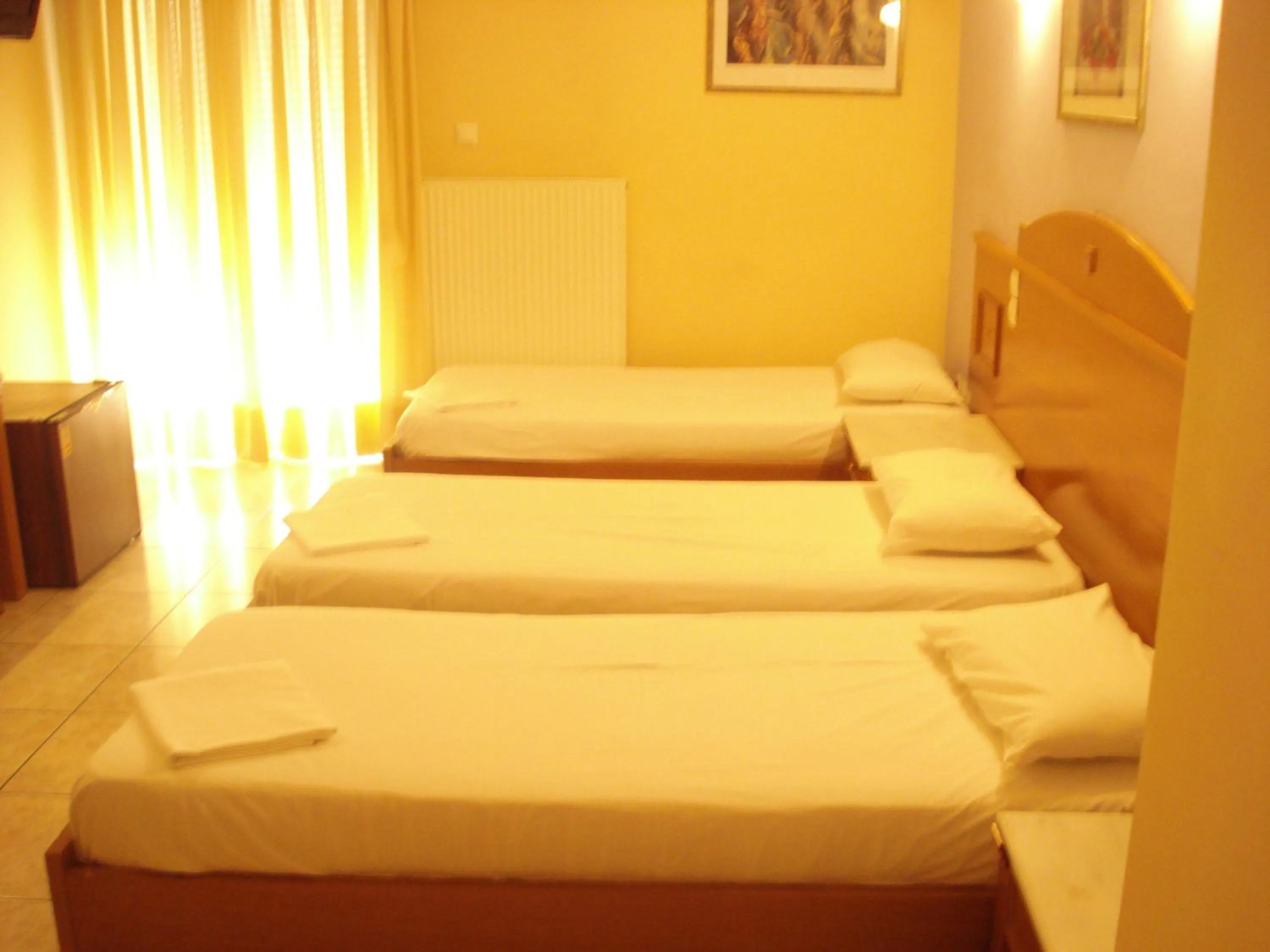Bed in Hotel Cybele Pefki