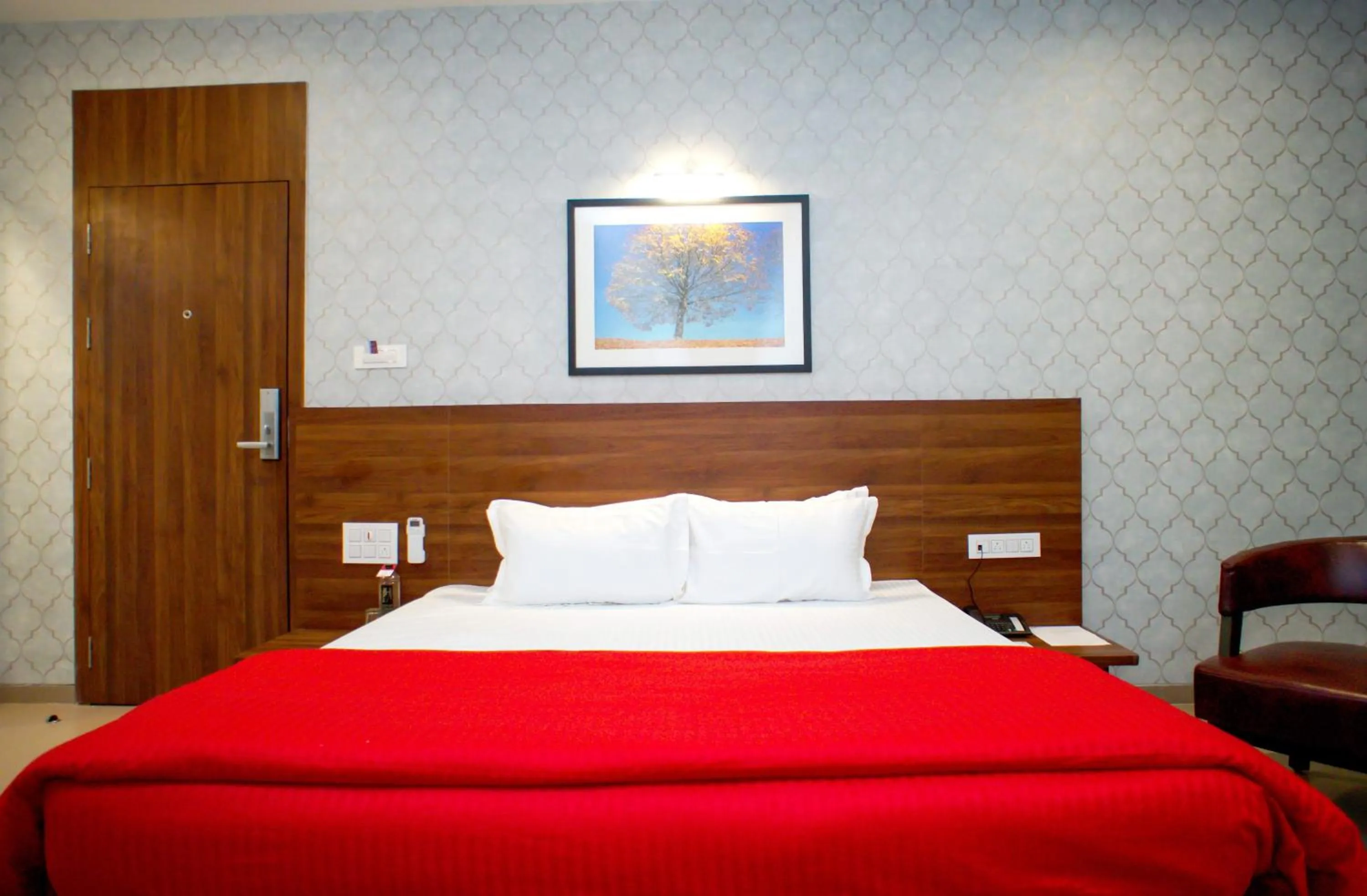 Bedroom, Bed in Mastiff Hotel Chinchwad by OTHPL