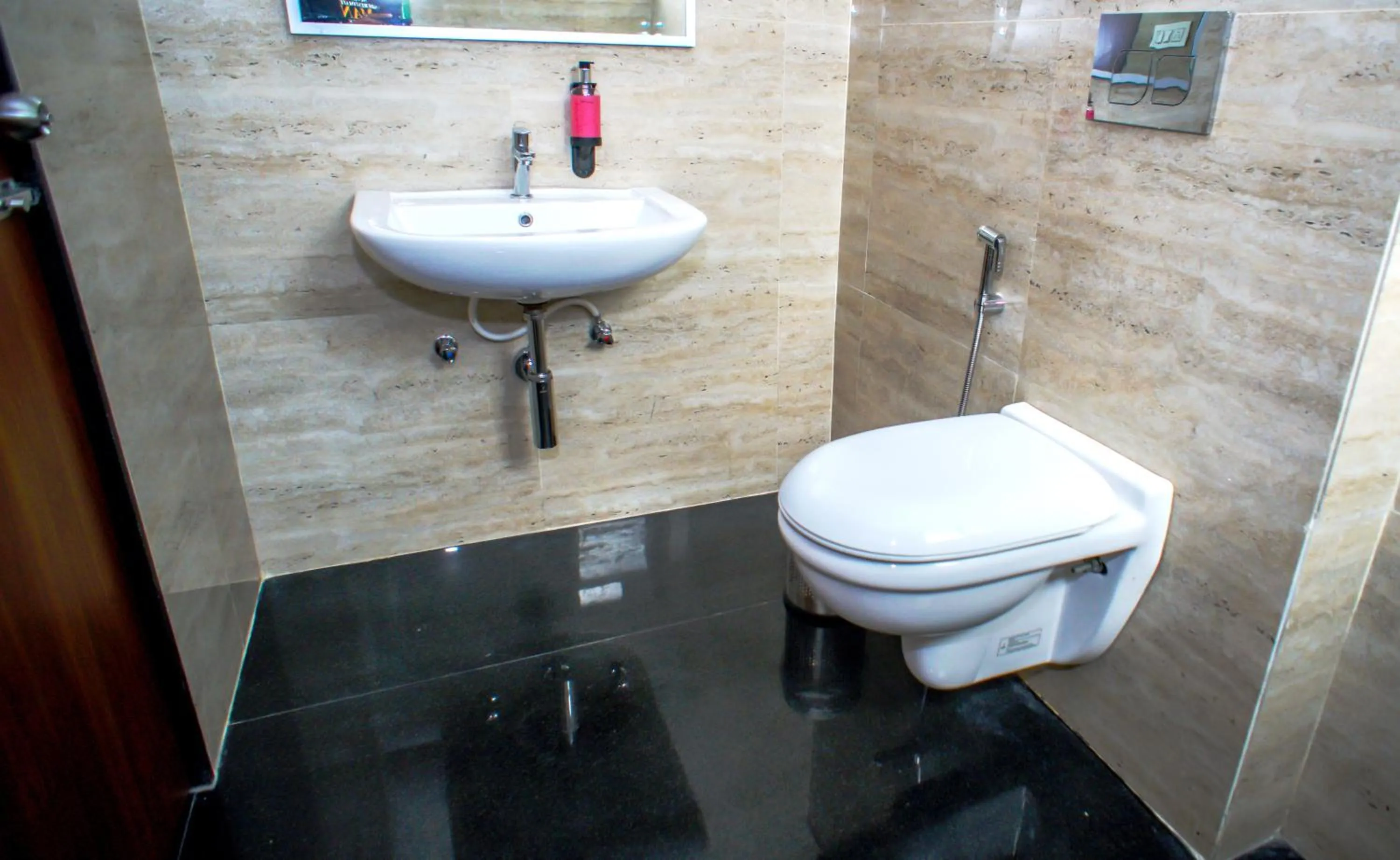 Bathroom in Mastiff Hotel Chinchwad by OTHPL