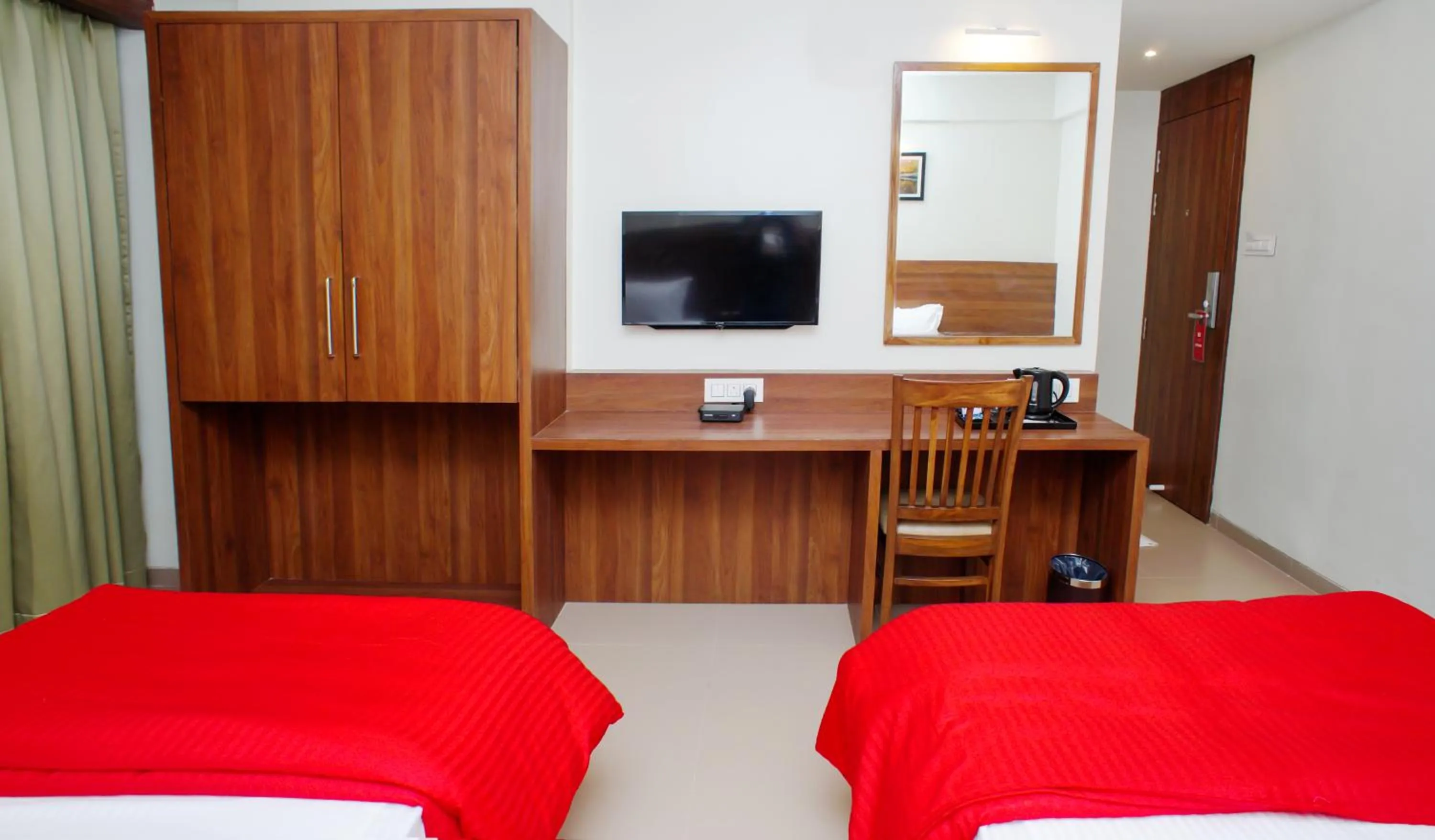 Seating area, Bed in Mastiff Hotel Chinchwad by OTHPL