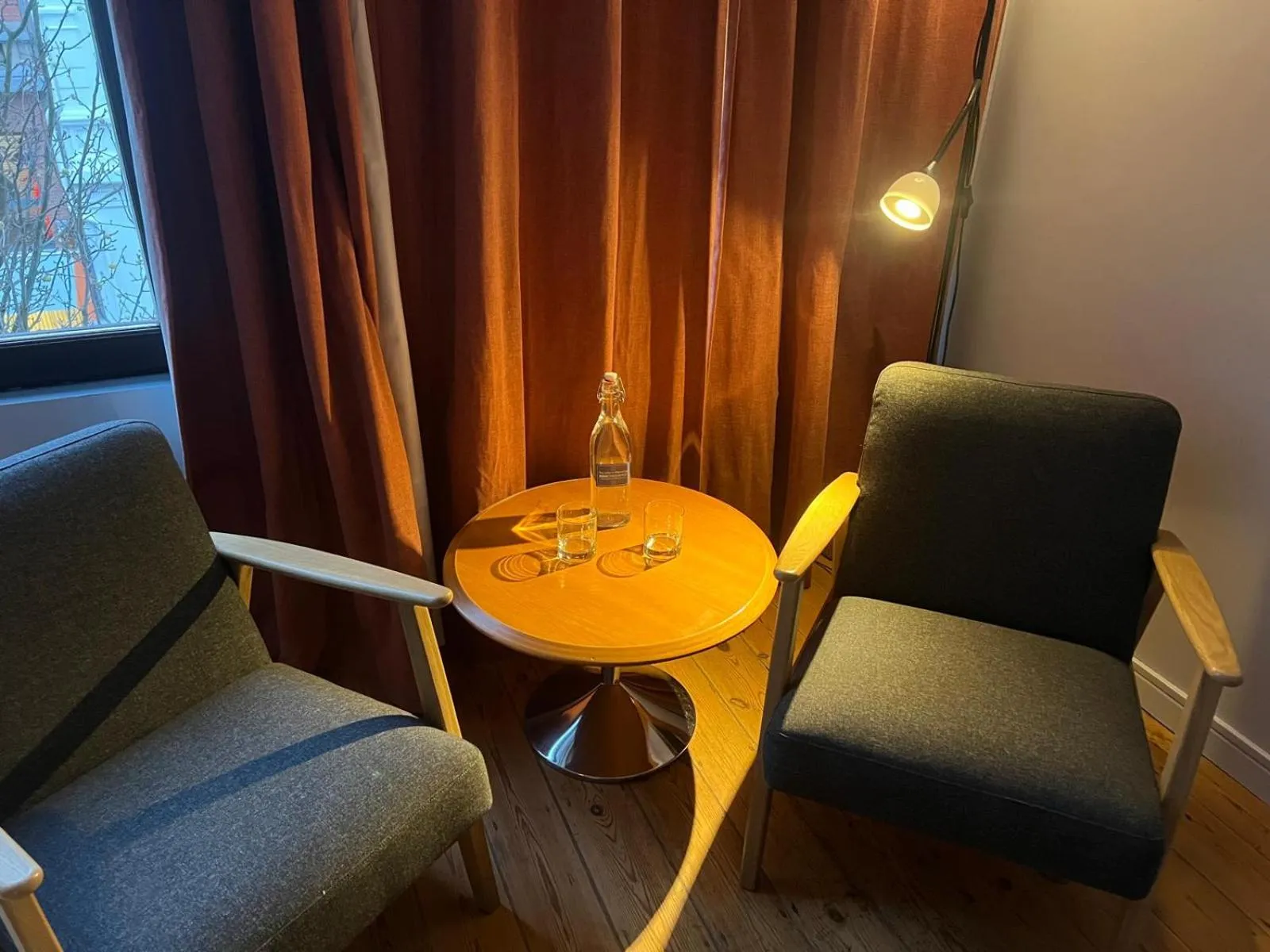 Seating area in Because the Night city lodge