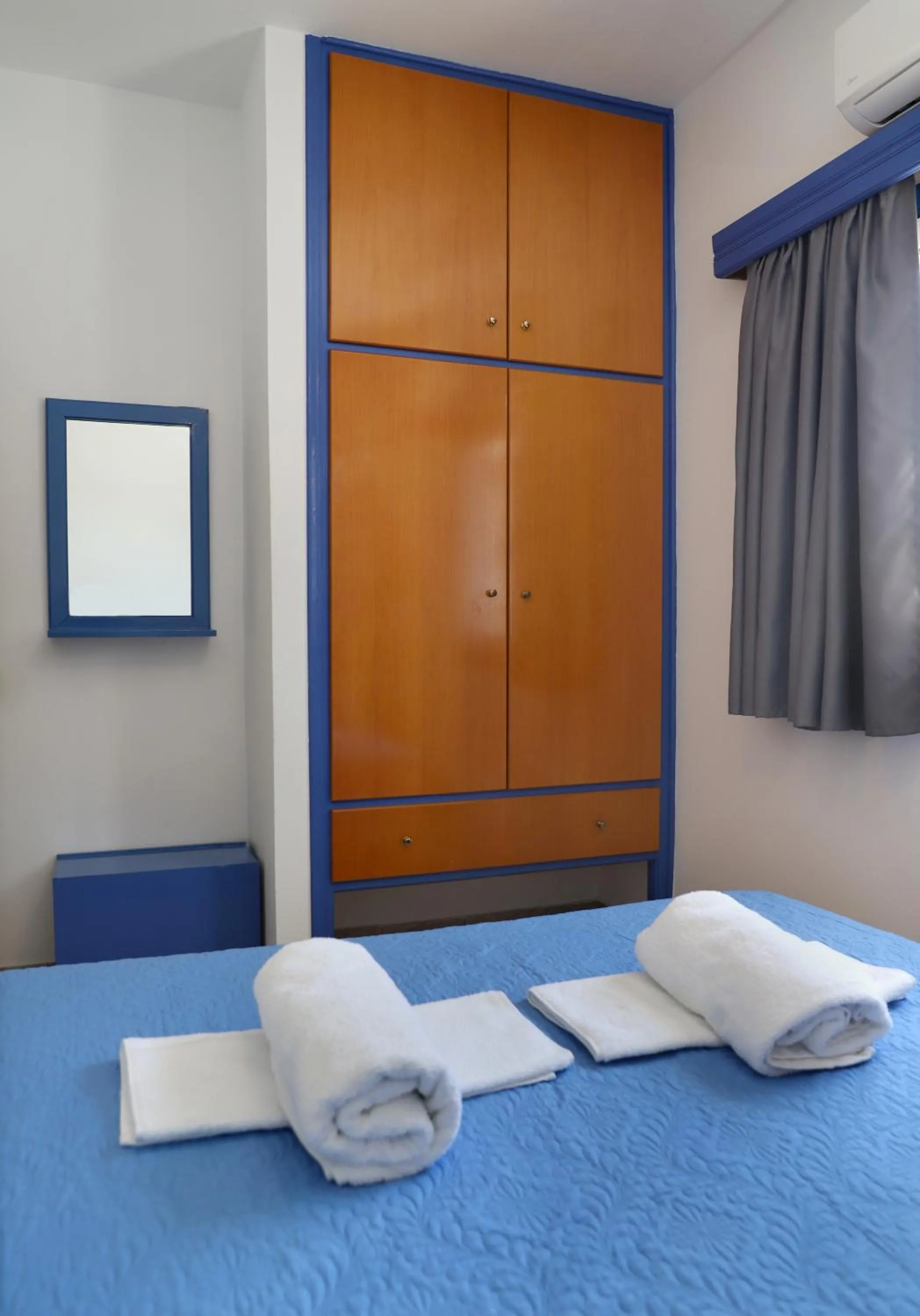 Bed in Helios Studios & Apartments